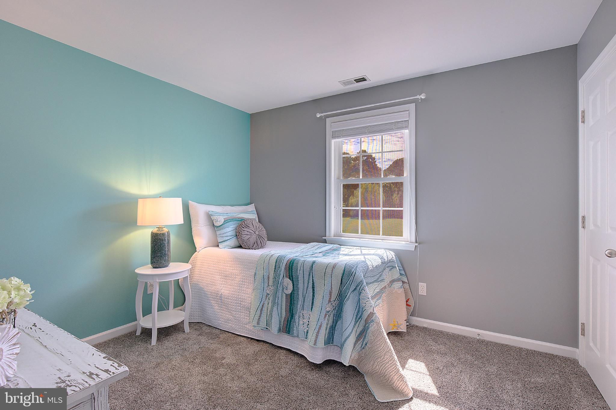 123 Bentons Pleasure Road Chester, MD 21619 - Photo 31 of 63 a bedroom with a bed and a window