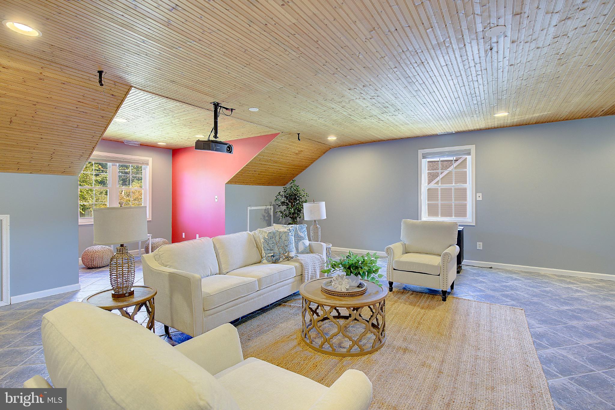 123 Bentons Pleasure Road Chester, MD 21619 - Photo 41 of 63 a living room with furniture and wooden floor