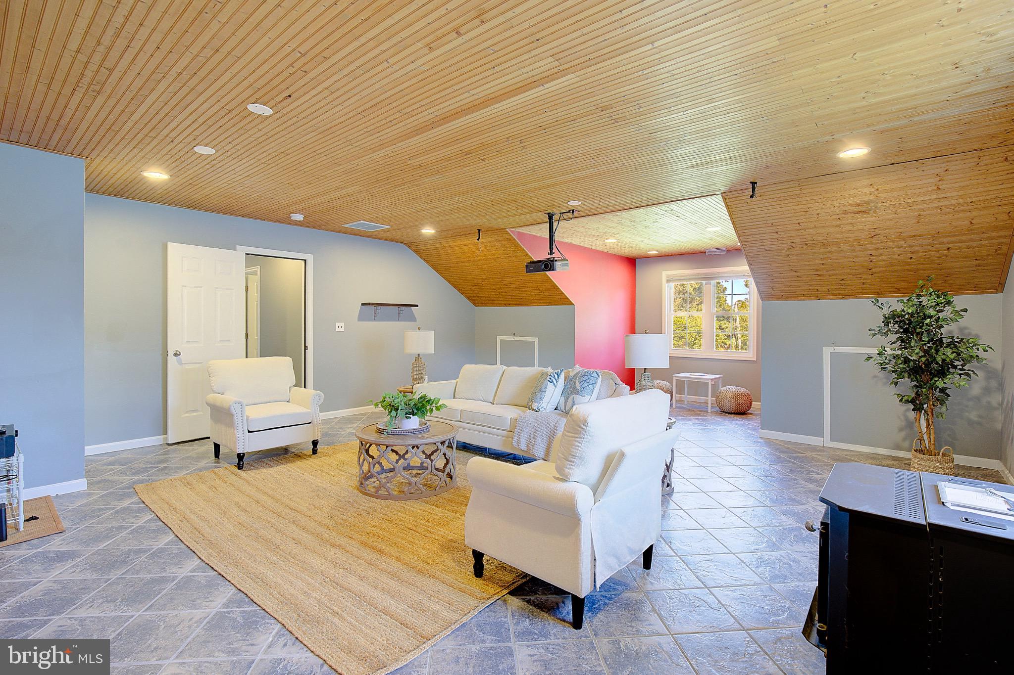 123 Bentons Pleasure Road Chester, MD 21619 - Photo 42 of 63 a living room with furniture and a large window