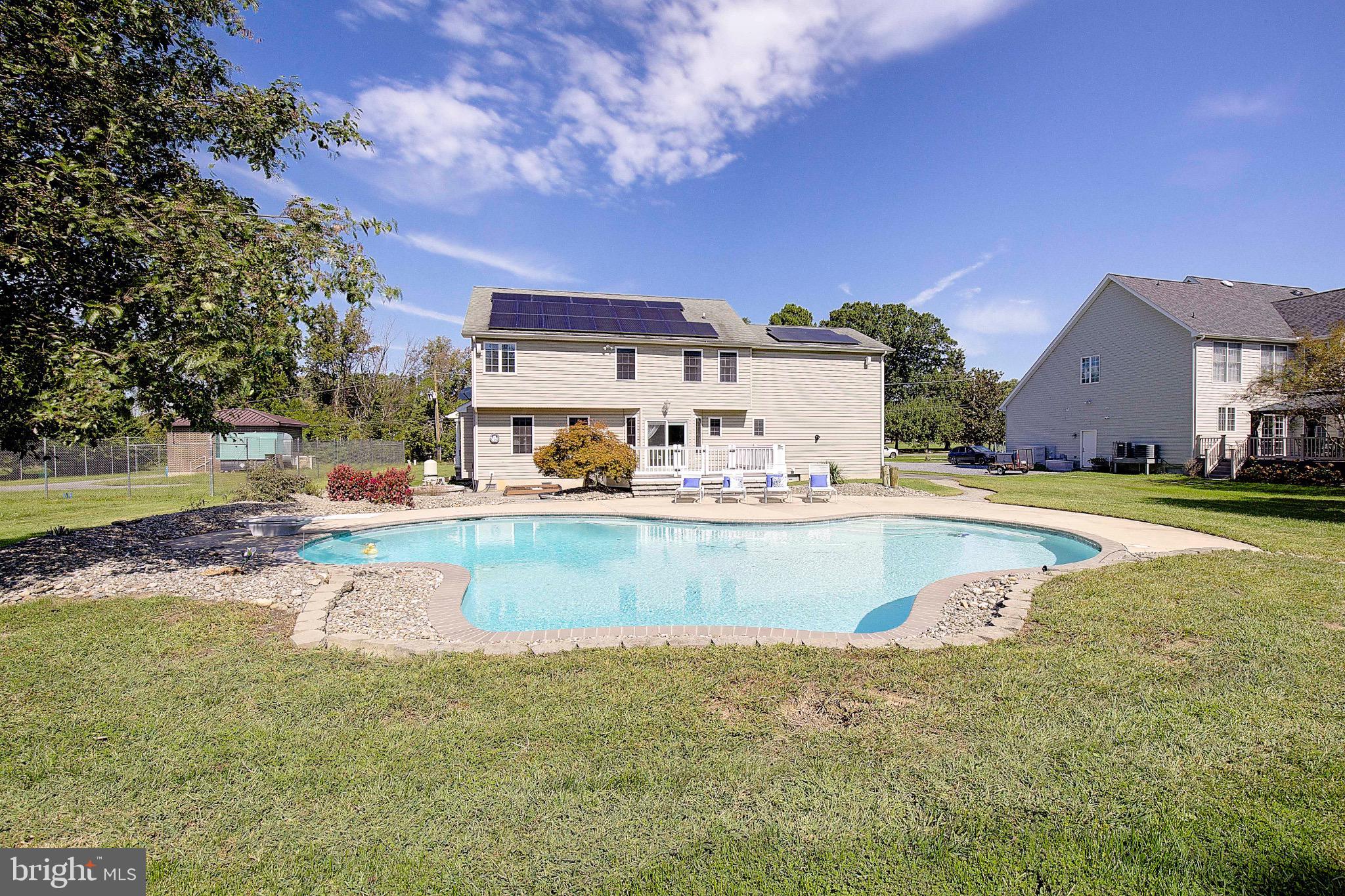 123 Bentons Pleasure Road Chester, MD 21619 - Photo 49 of 63 a view of a house with a swimming pool