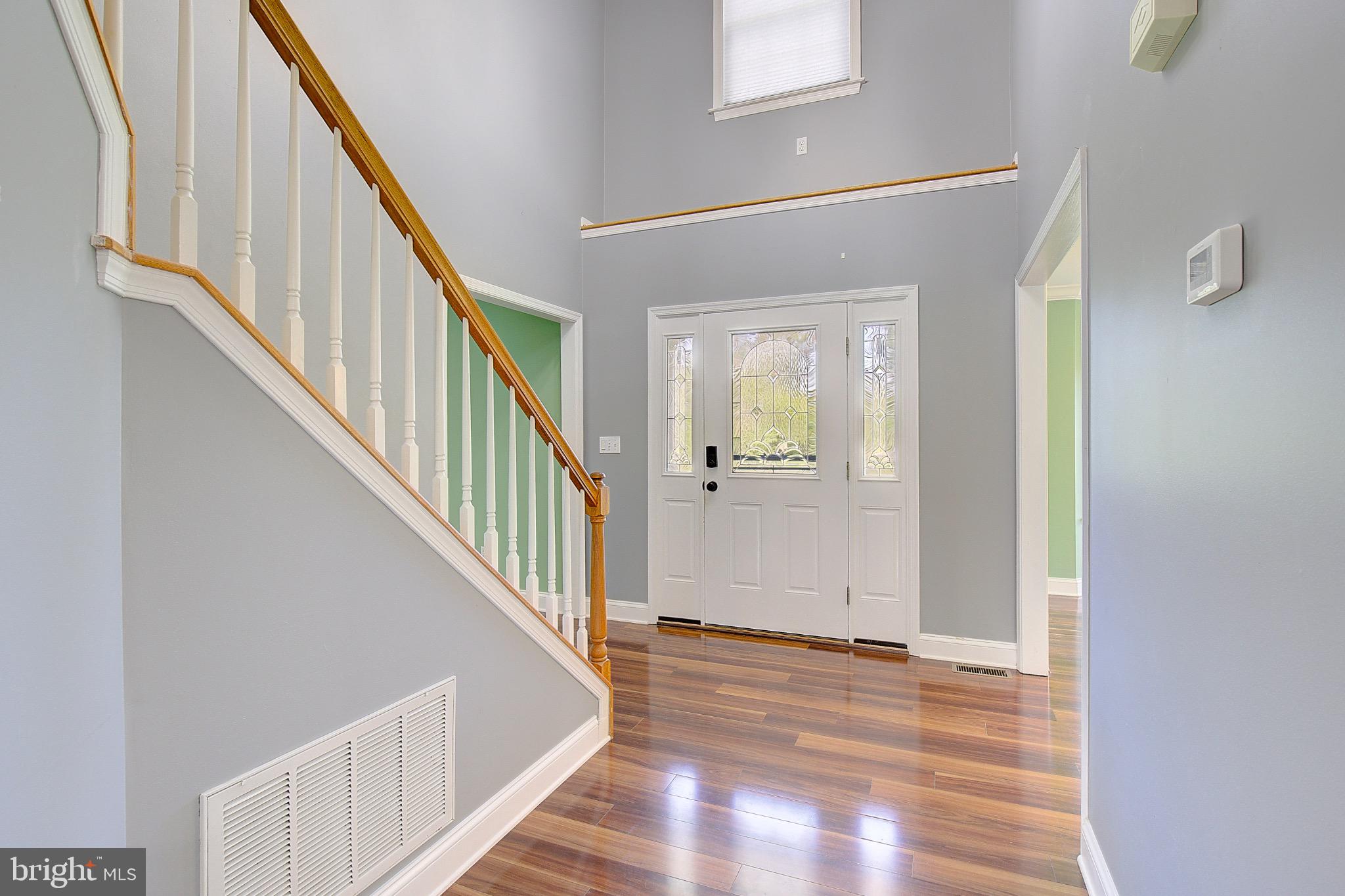 123 Bentons Pleasure Road Chester, MD 21619 - Photo 5 of 63 a view of an entryway with wooden floor and stairs