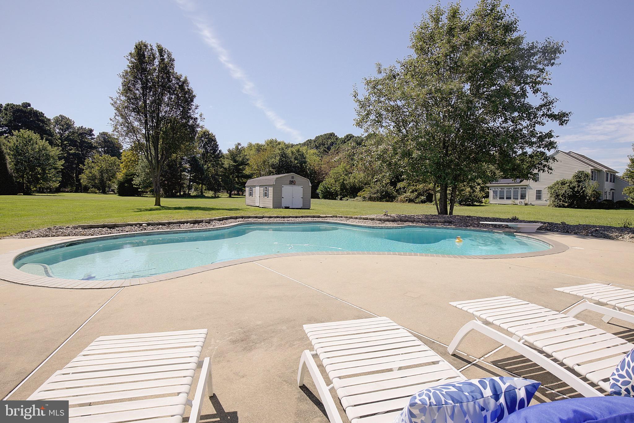 123 Bentons Pleasure Road Chester, MD 21619 - Photo 55 of 63 a view of a swimming pool with a yard