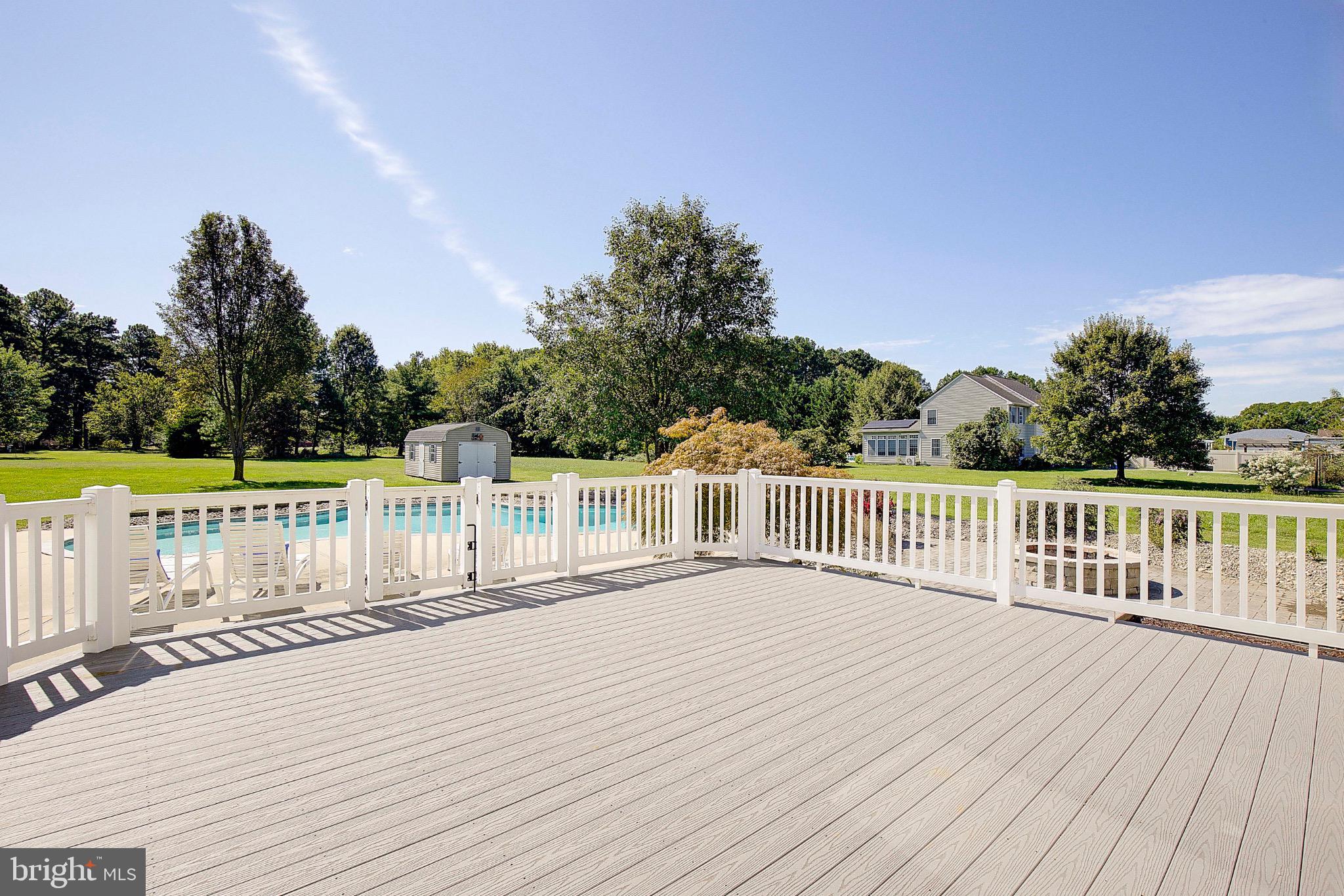 123 Bentons Pleasure Road Chester, MD 21619 - Photo 57 of 63 a view of deck with wooden floor and fence with a large tree