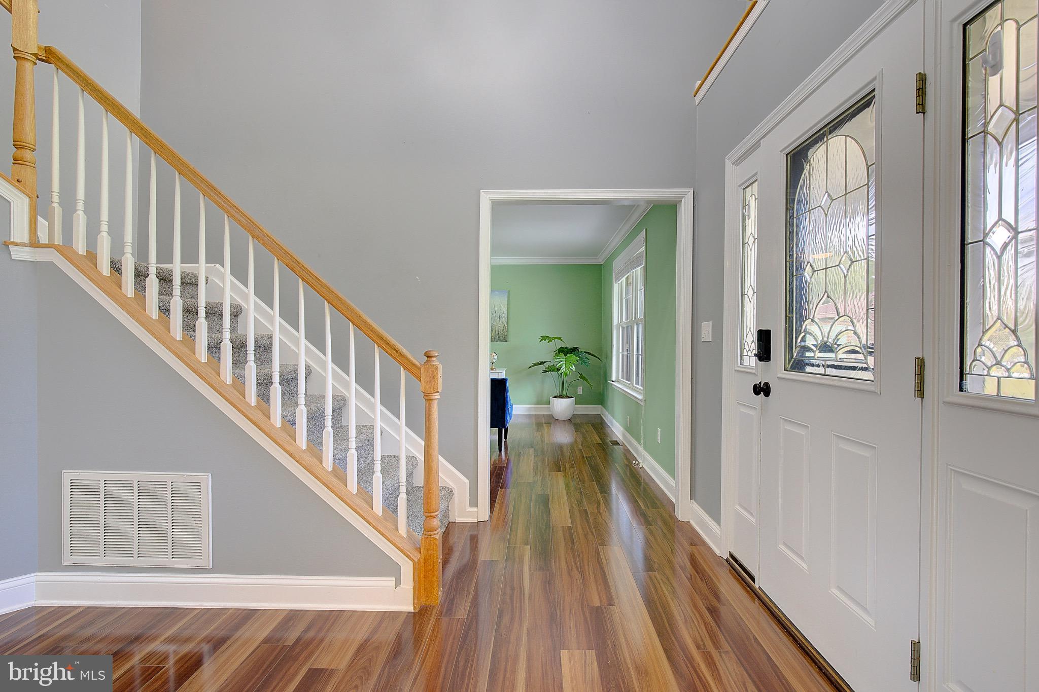 123 Bentons Pleasure Road Chester, MD 21619 - Photo 6 of 63 a view of a hallway view with wooden floor and staircase