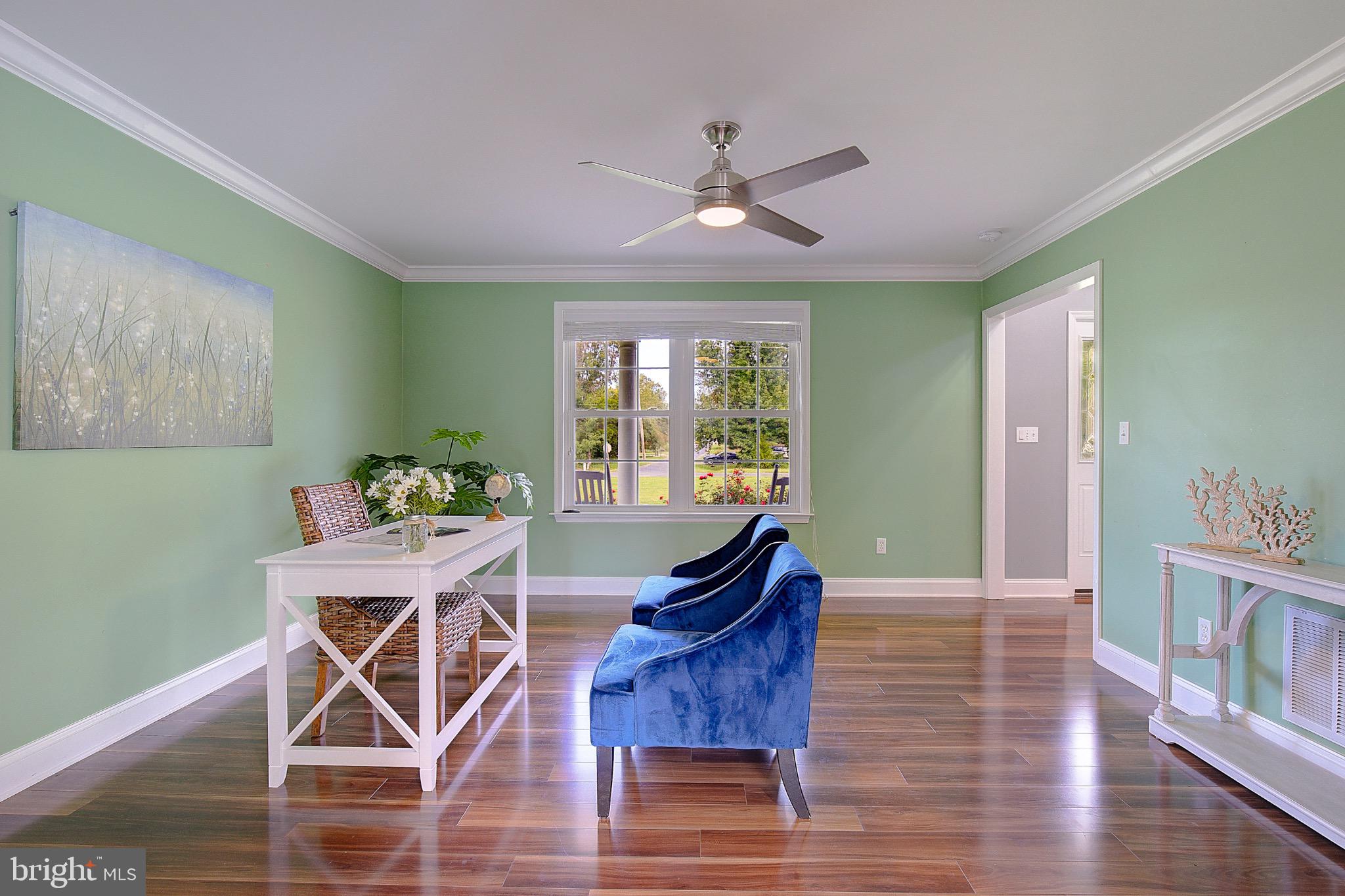 123 Bentons Pleasure Road Chester, MD 21619 - Photo 7 of 63 a view of a dining room with furniture window and wooden floor