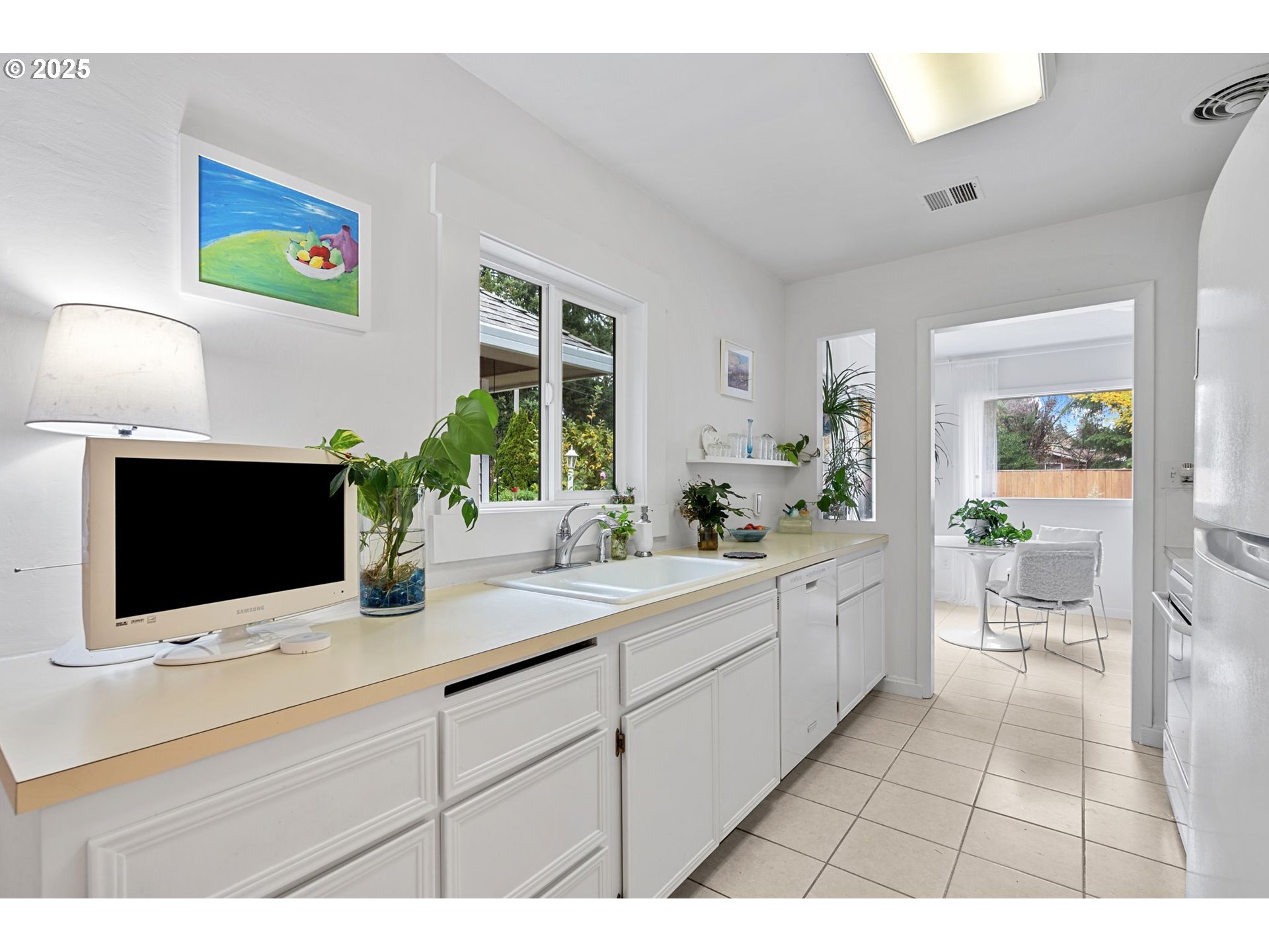 15390 Southwest Davis Road Beaverton, OR 97007 - Photo 11 of 46 a bathroom with a sink a mirror and a potted plant