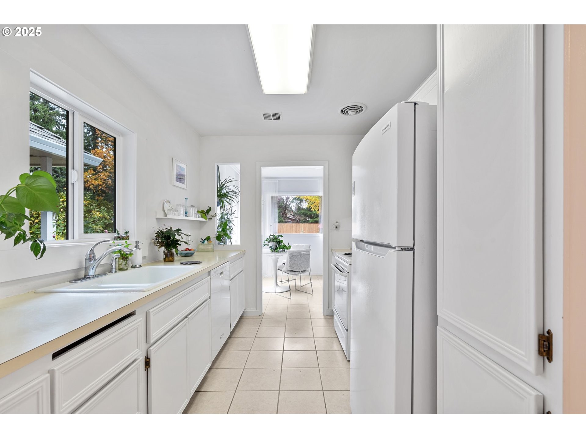 15390 Southwest Davis Road Beaverton, OR 97007 - Photo 12 of 46 a bathroom with a sink a mirror and a bathtub