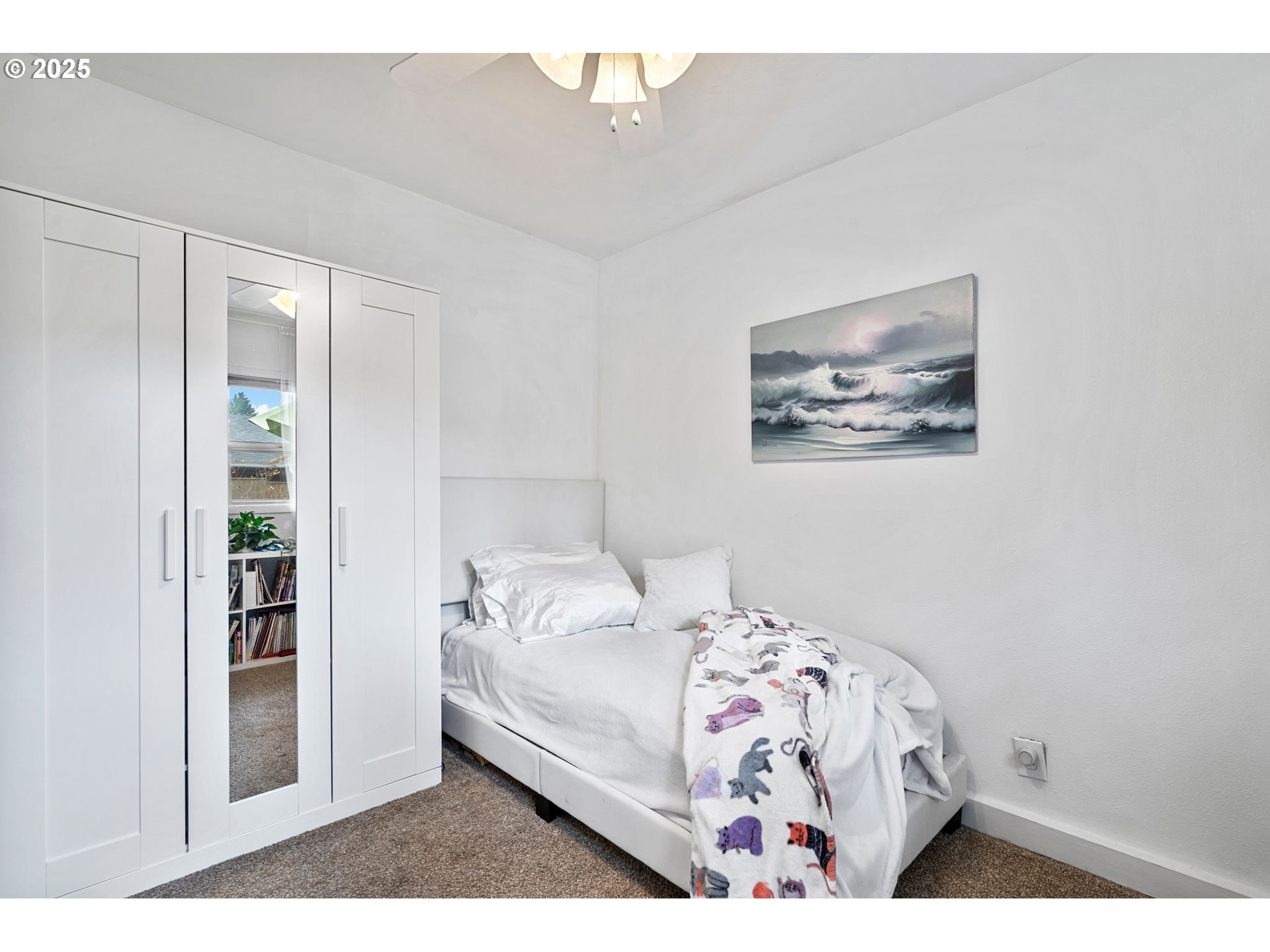 15390 Southwest Davis Road Beaverton, OR 97007 - Photo 18 of 46 a bedroom with a bed and a painting on the wall