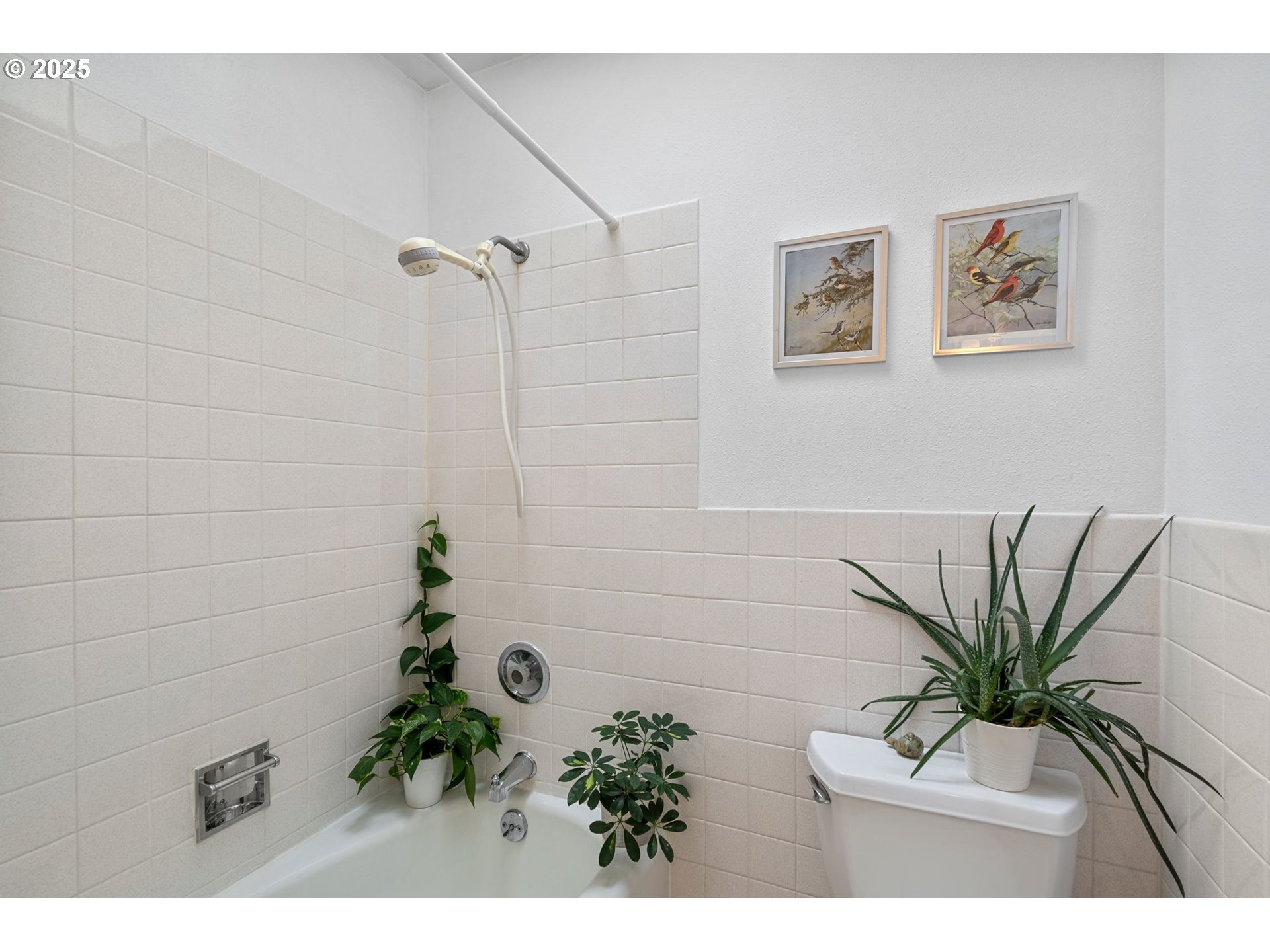 15390 Southwest Davis Road Beaverton, OR 97007 - Photo 21 of 46 a picture of a flower room with a flower pot and a wooden floor