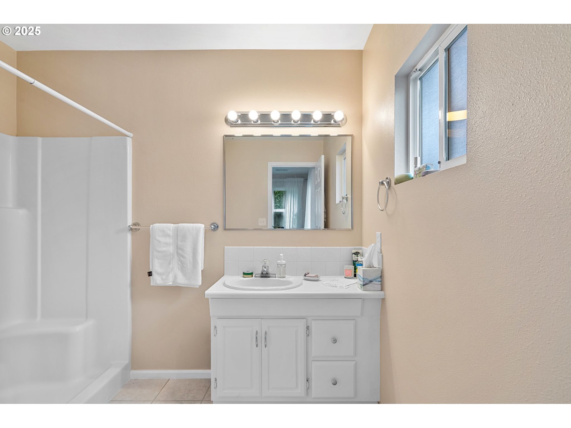 15390 Southwest Davis Road Beaverton, OR 97007 - Photo 26 of 46 a bathroom with a sink and a mirror