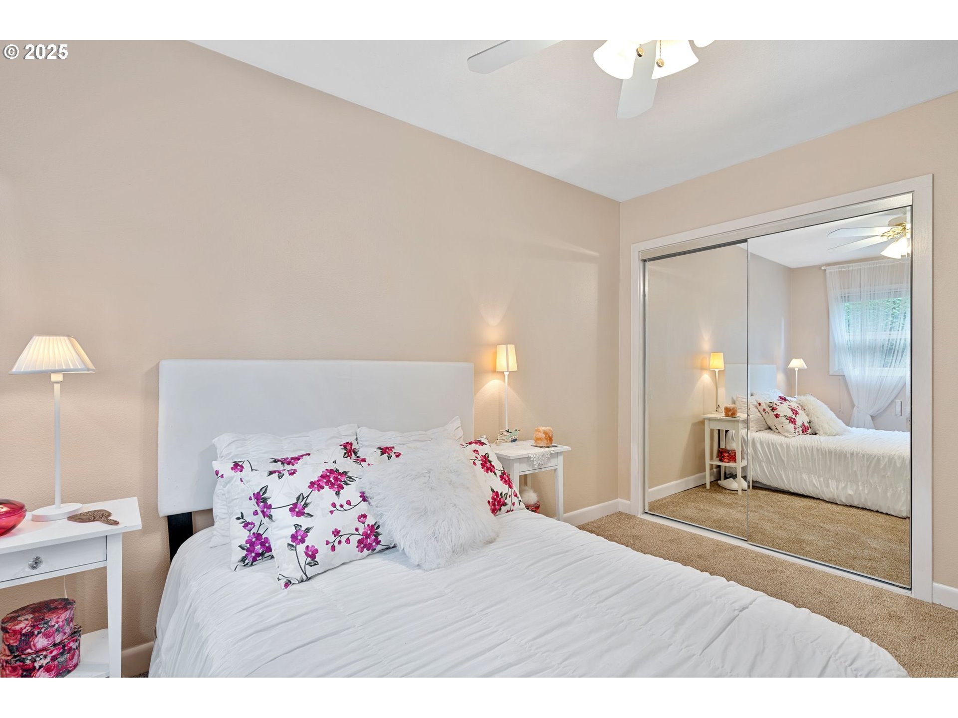 15390 Southwest Davis Road Beaverton, OR 97007 - Photo 29 of 46 a bedroom with a bed and a chandelier