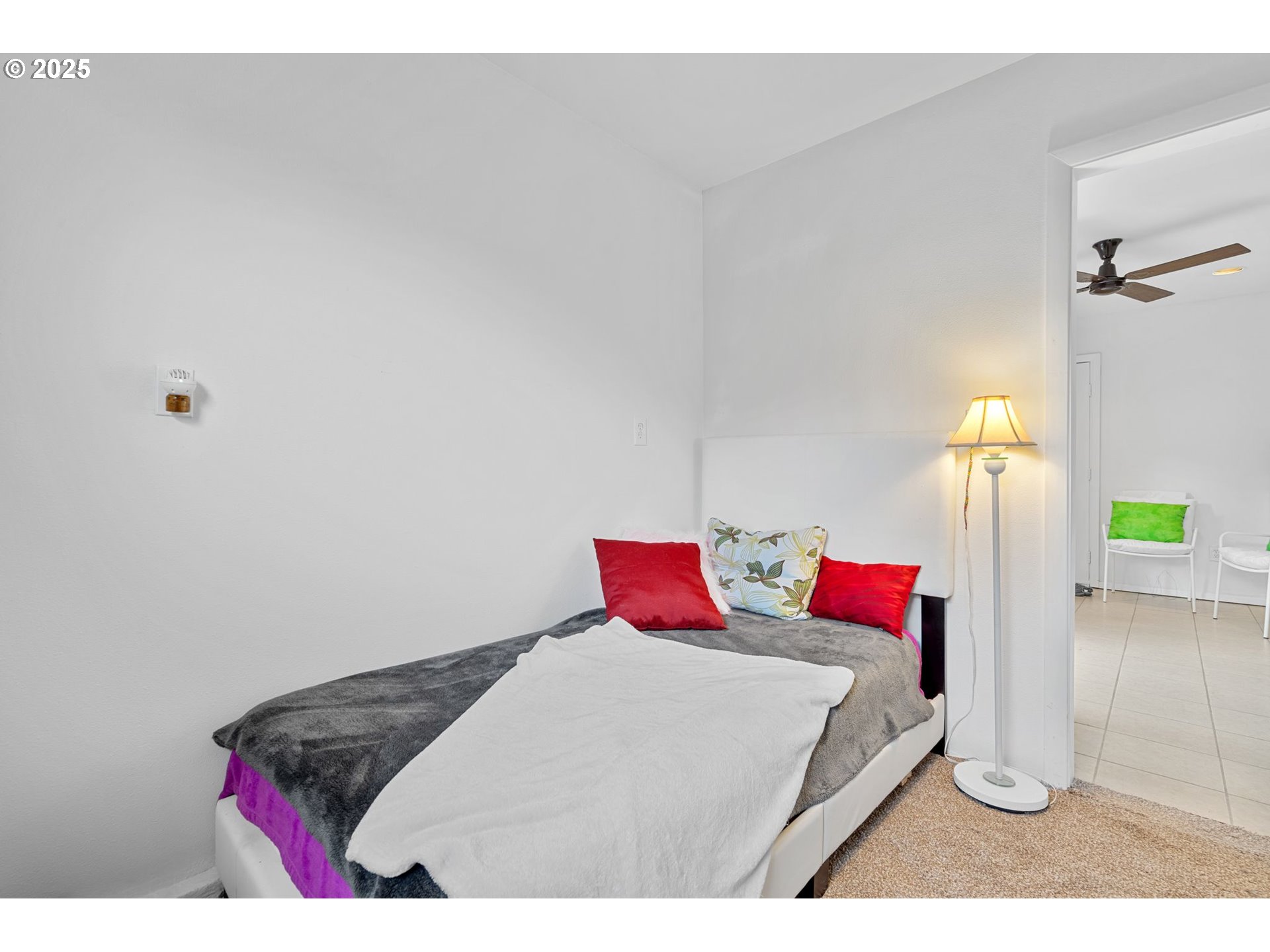 15390 Southwest Davis Road Beaverton, OR 97007 - Photo 35 of 46 a bed room with a bed and a couch