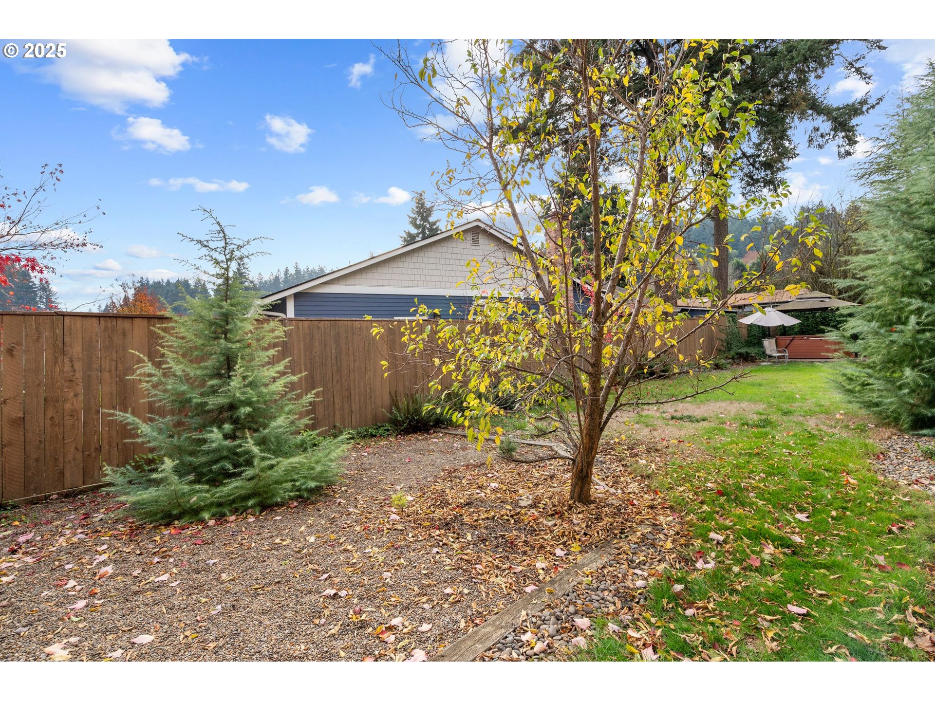 15390 Southwest Davis Road Beaverton, OR 97007 - Photo 45 of 46 a backyard of a house with lots of green space