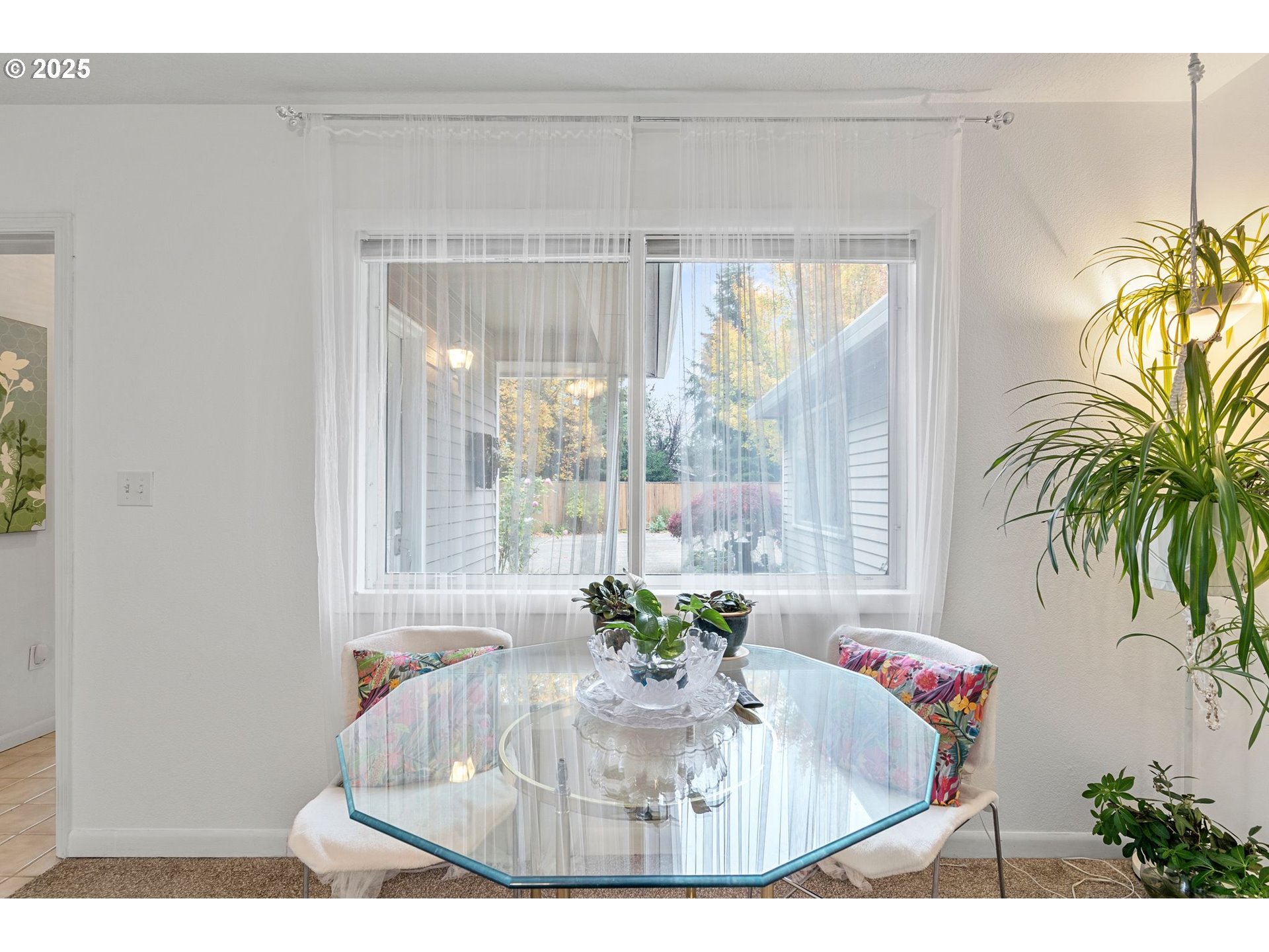 15390 Southwest Davis Road Beaverton, OR 97007 - Photo 10 of 46 a view of a dining room with a table and chairs