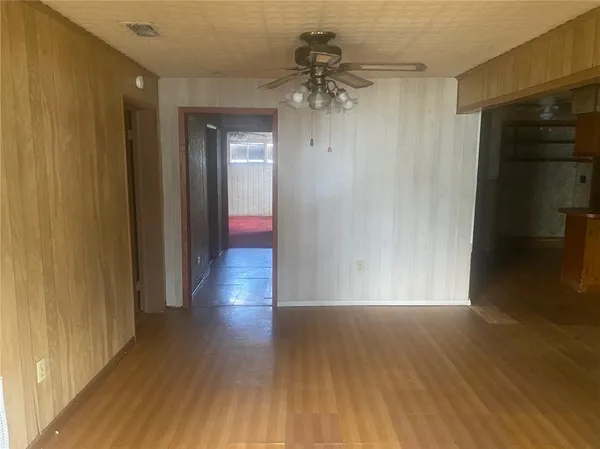 a view of a room with wooden floor