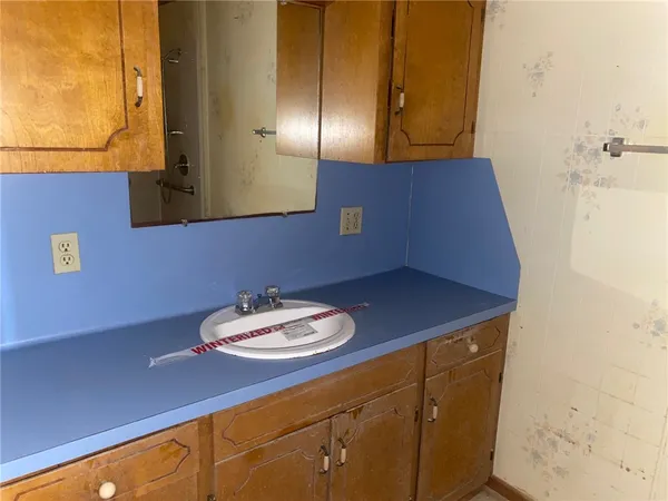 a bathroom with a sink and a mirror