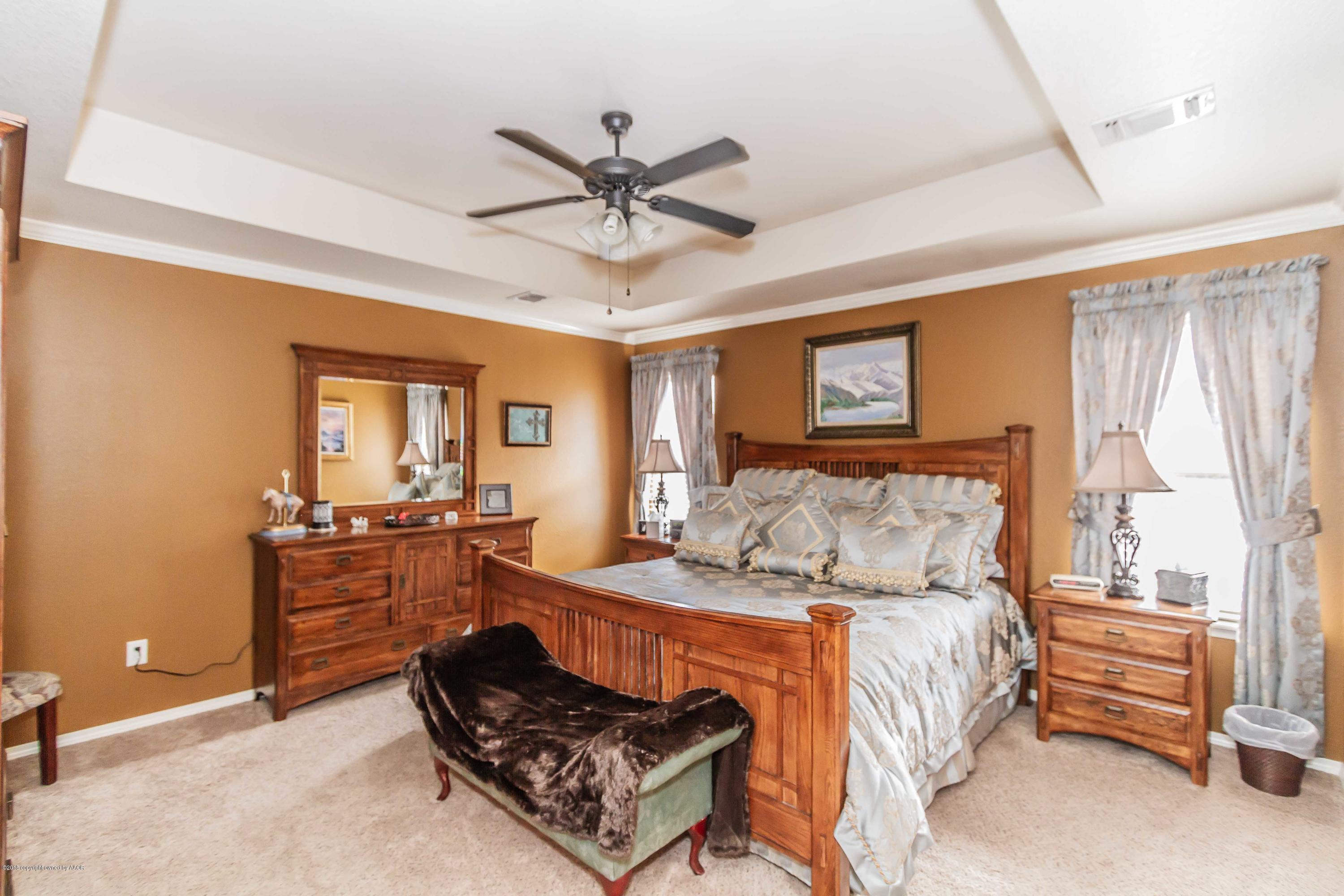 3707 Arden Road Amarillo, TX 79118 - Photo 13 of 32 a bed room with a bed and furniture
