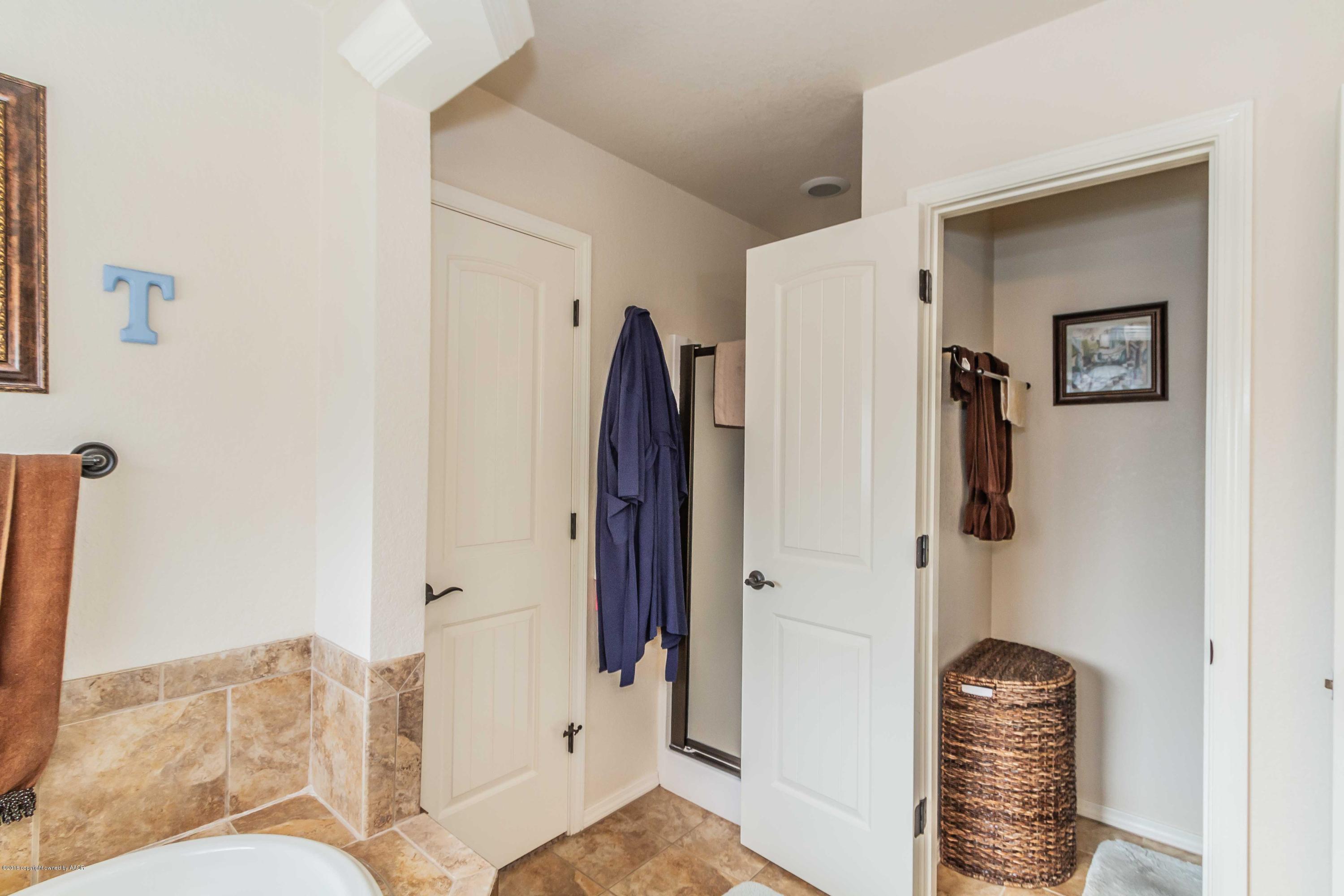 3707 Arden Road Amarillo, TX 79118 - Photo 19 of 32 a bathroom with a shower