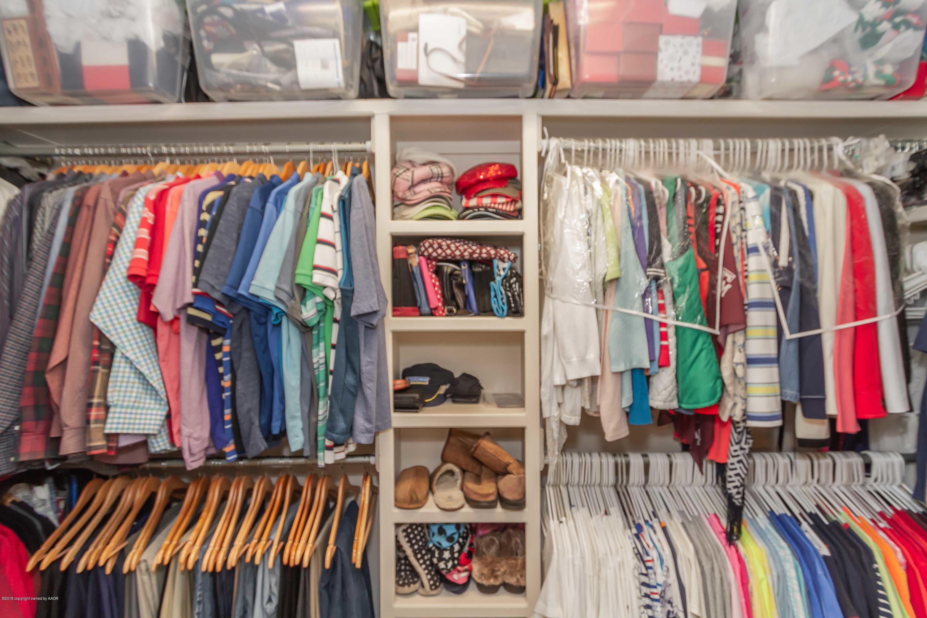 3707 Arden Road Amarillo, TX 79118 - Photo 20 of 32 a view of walk in closet with clothes and shoes