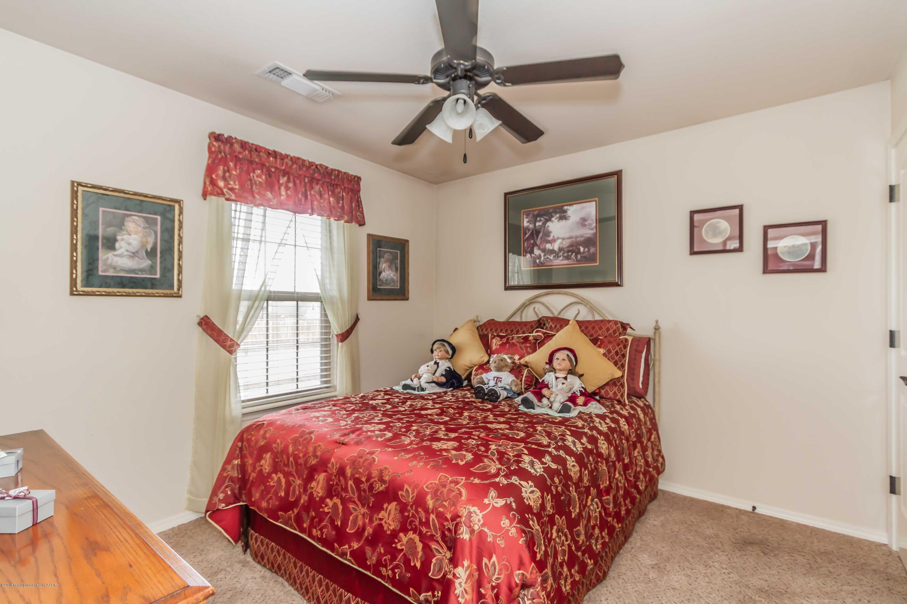 3707 Arden Road Amarillo, TX 79118 - Photo 21 of 32 a bedroom with a large bed and a window