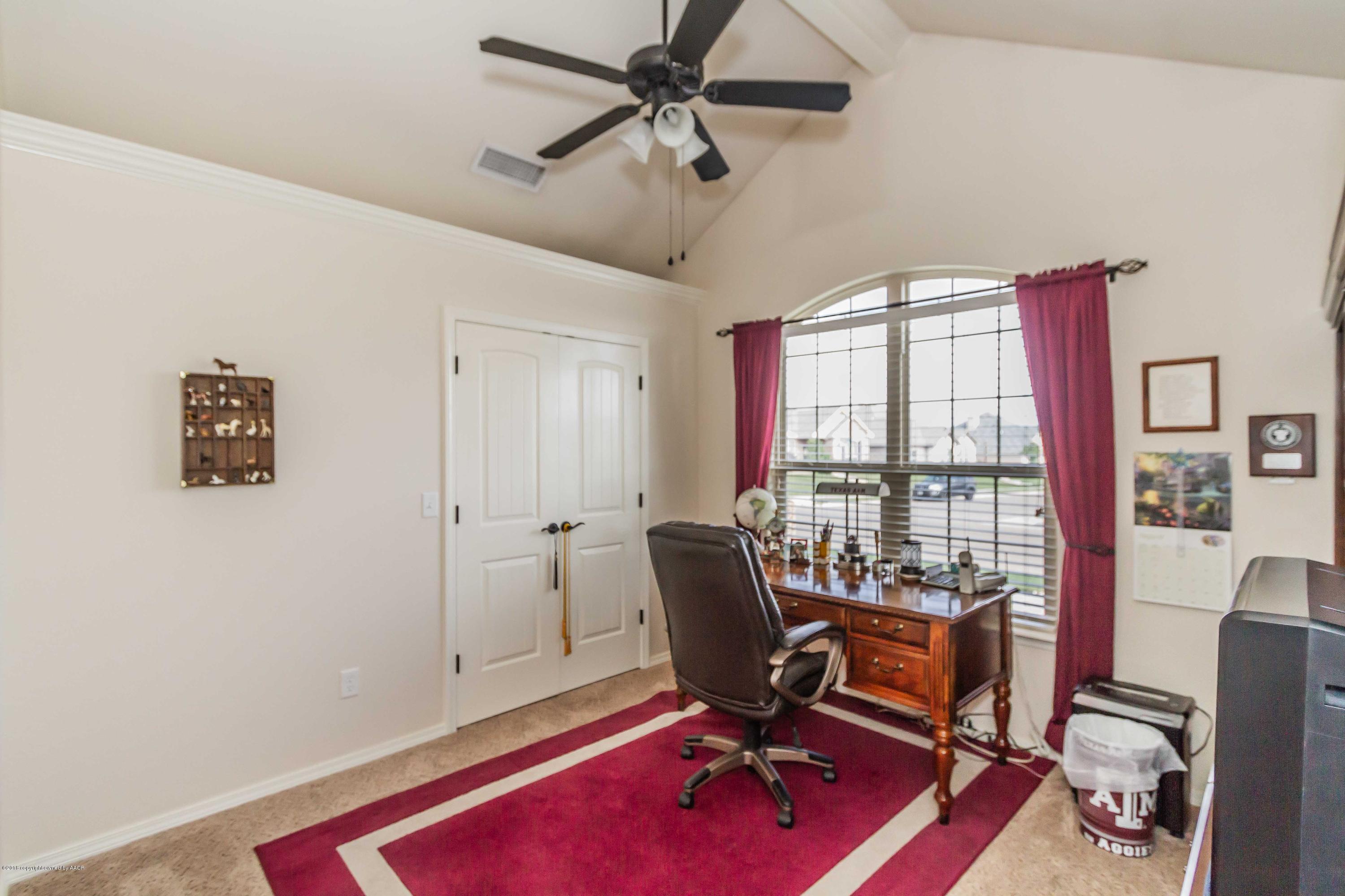3707 Arden Road Amarillo, TX 79118 - Photo 25 of 32 a view of a workspace with furniture and a window