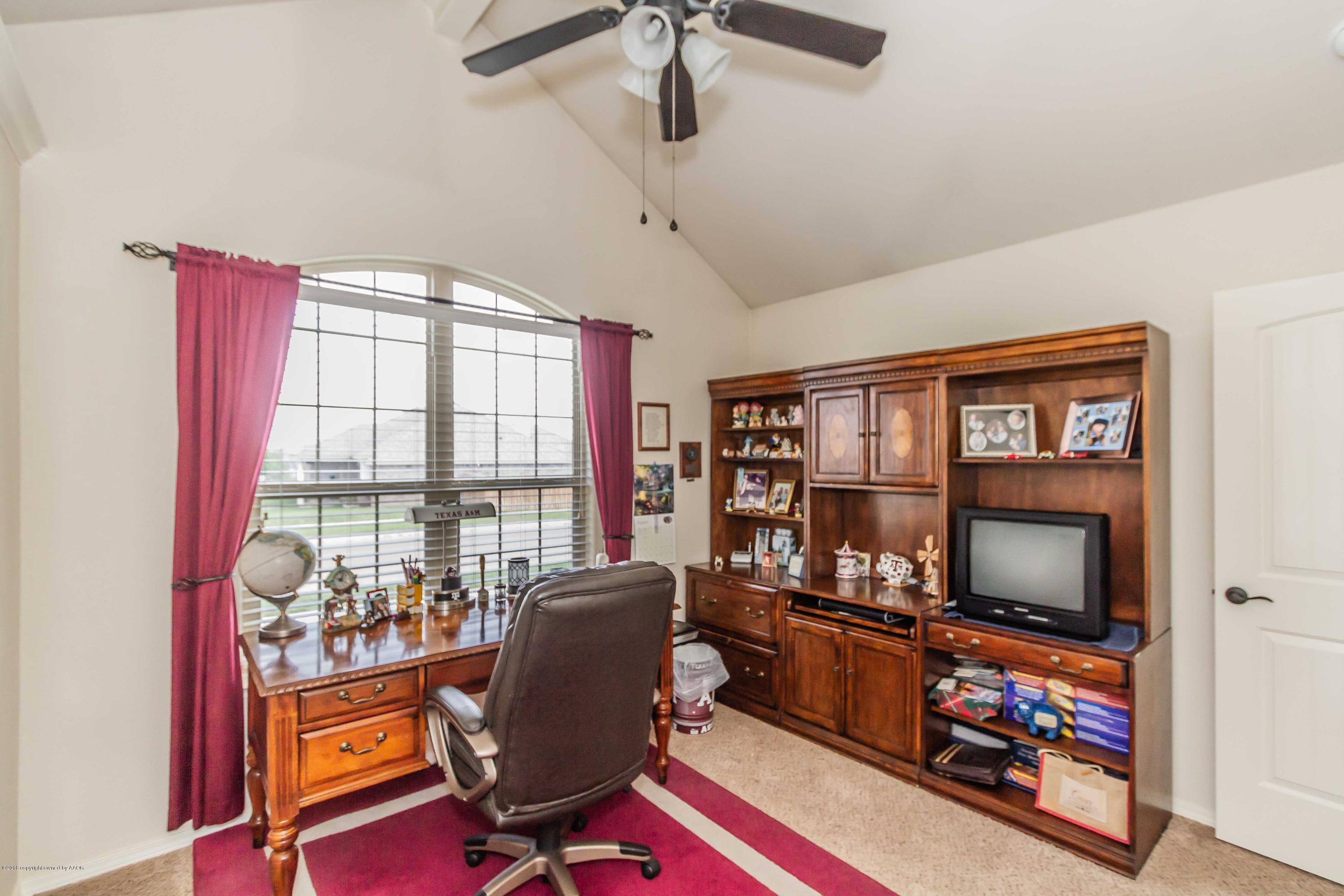 3707 Arden Road Amarillo, TX 79118 - Photo 26 of 32 a view of a workspace with furniture and a window