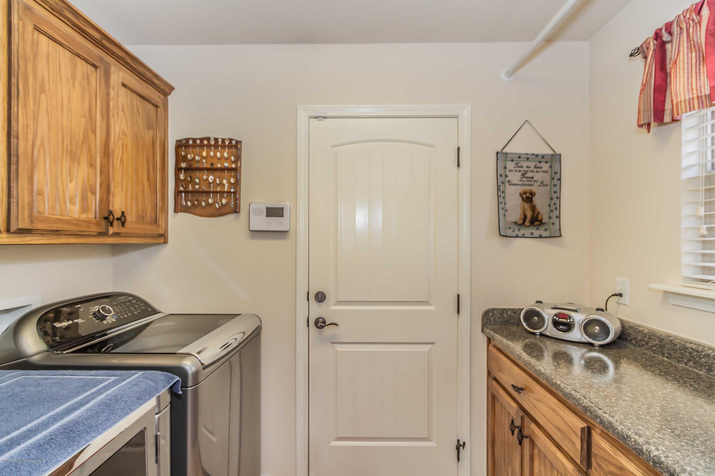 3707 Arden Road Amarillo, TX 79118 - Photo 29 of 32 a view of a storage and utility room in a house