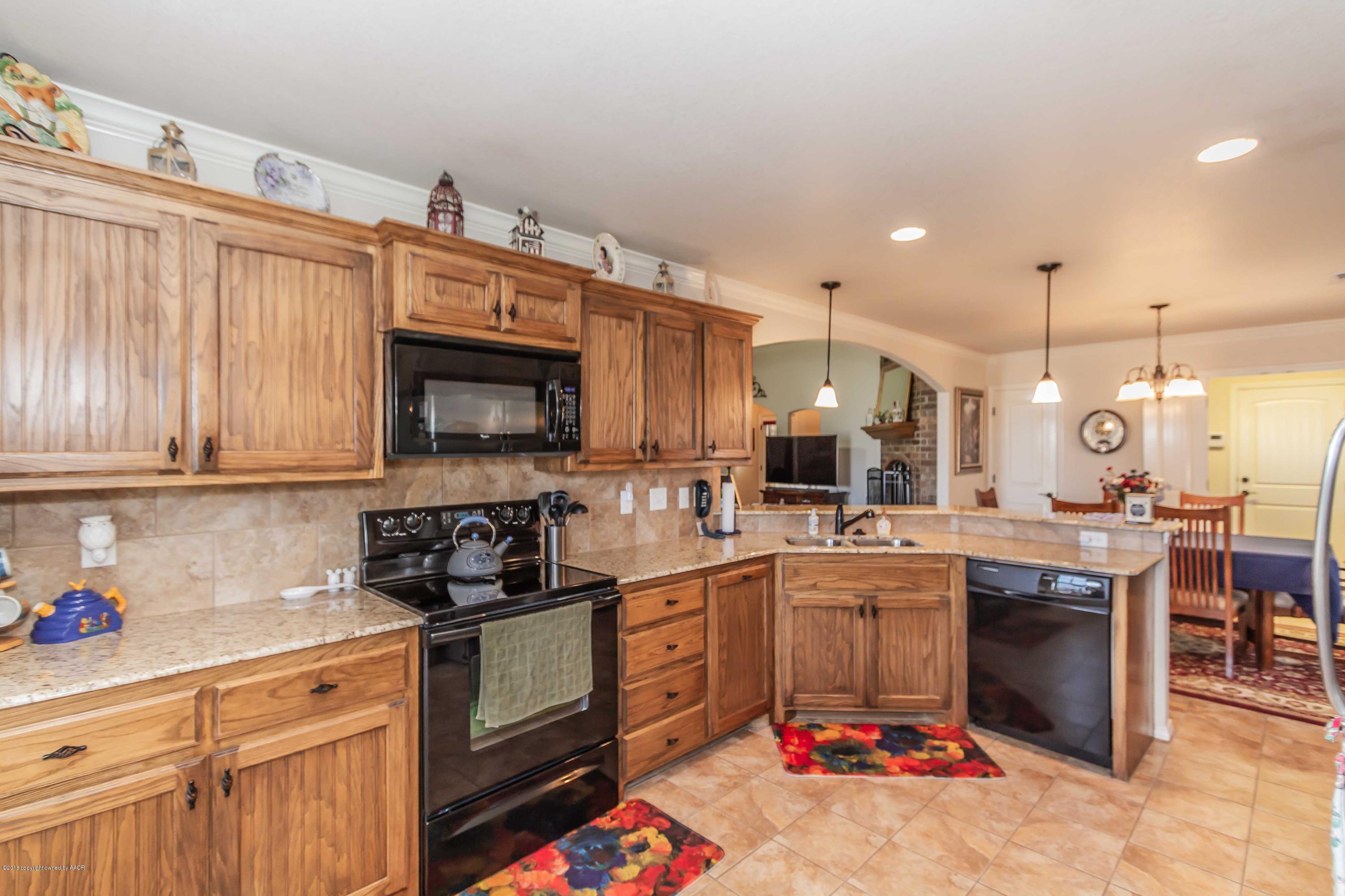 3707 Arden Road Amarillo, TX 79118 - Photo 9 of 32 a kitchen with lots of appliances
