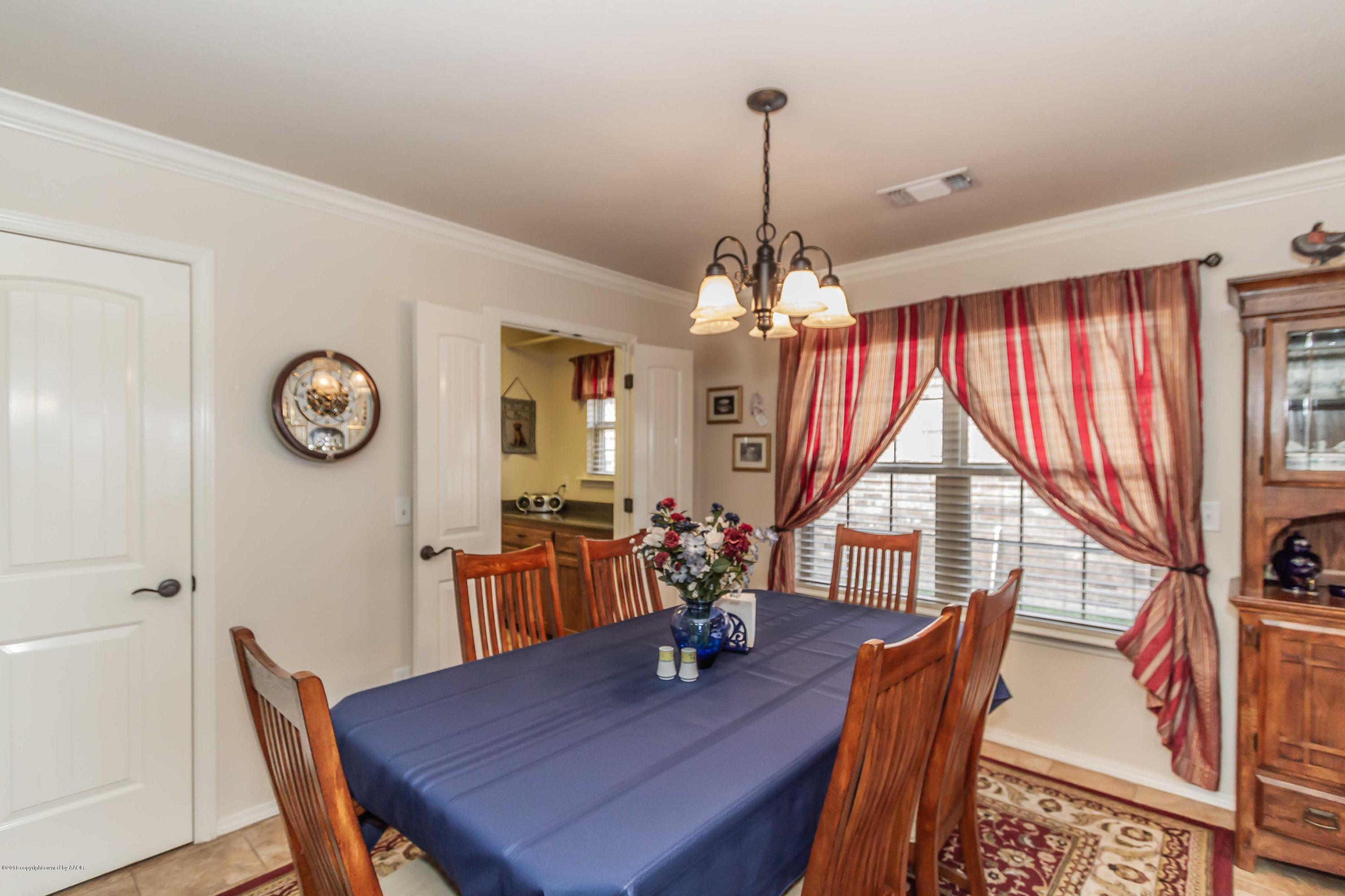 3707 Arden Road Amarillo, TX 79118 - Photo 10 of 32 a view of a dining room with furniture window and wooden floor