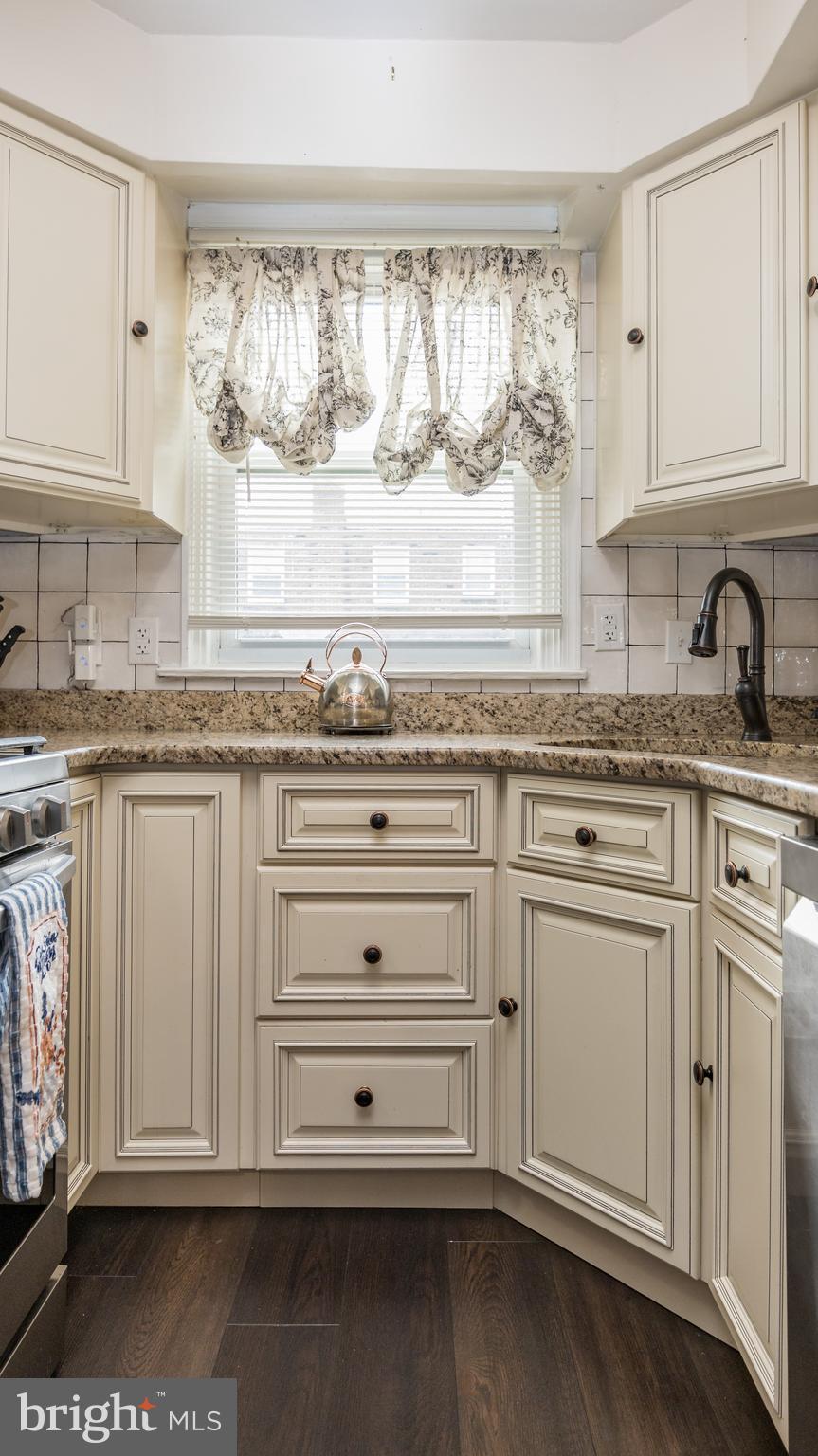 800 Disston Street Philadelphia, PA 19111 - Photo 15 of 51 a kitchen with granite countertop white cabinets and sink
