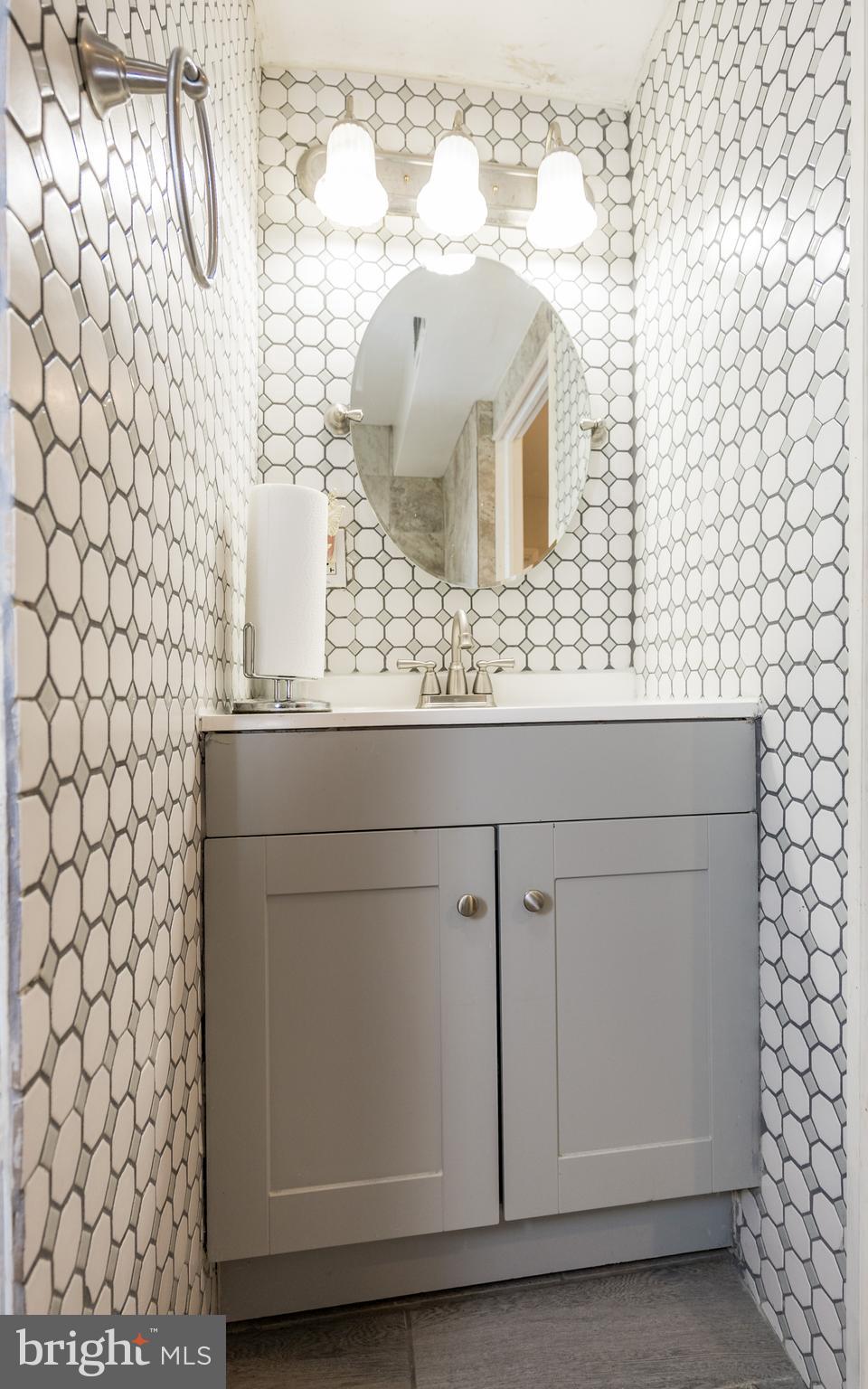 800 Disston Street Philadelphia, PA 19111 - Photo 28 of 51 a bathroom with a sink and a mirror