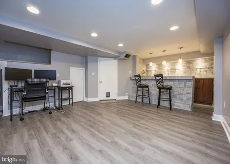 a room with furniture and a flat screen tv