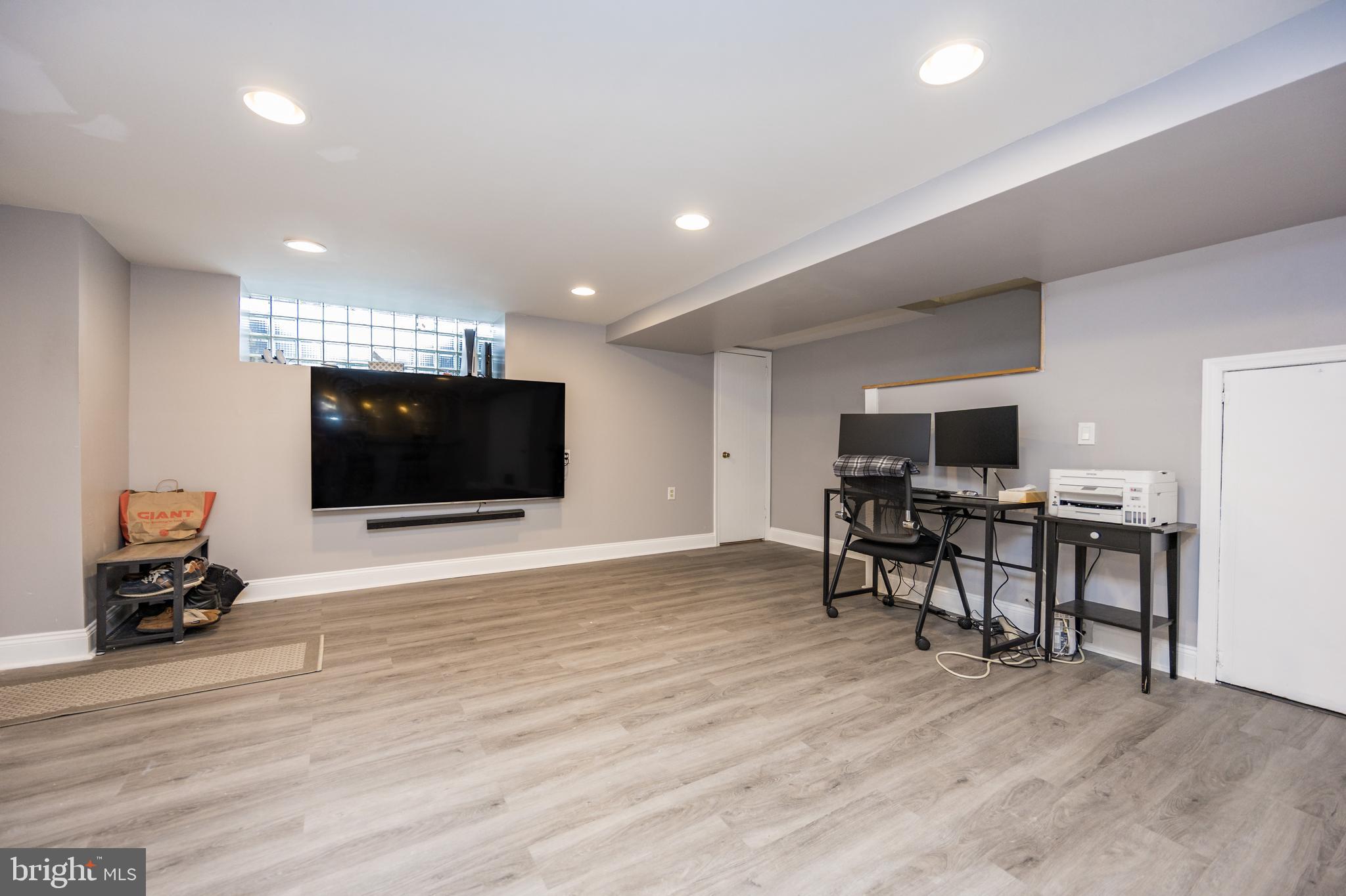 800 Disston Street Philadelphia, PA 19111 - Photo 40 of 51 a room with furniture and a flat screen tv