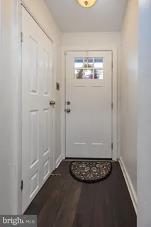 an view of an entryway with wooden floor