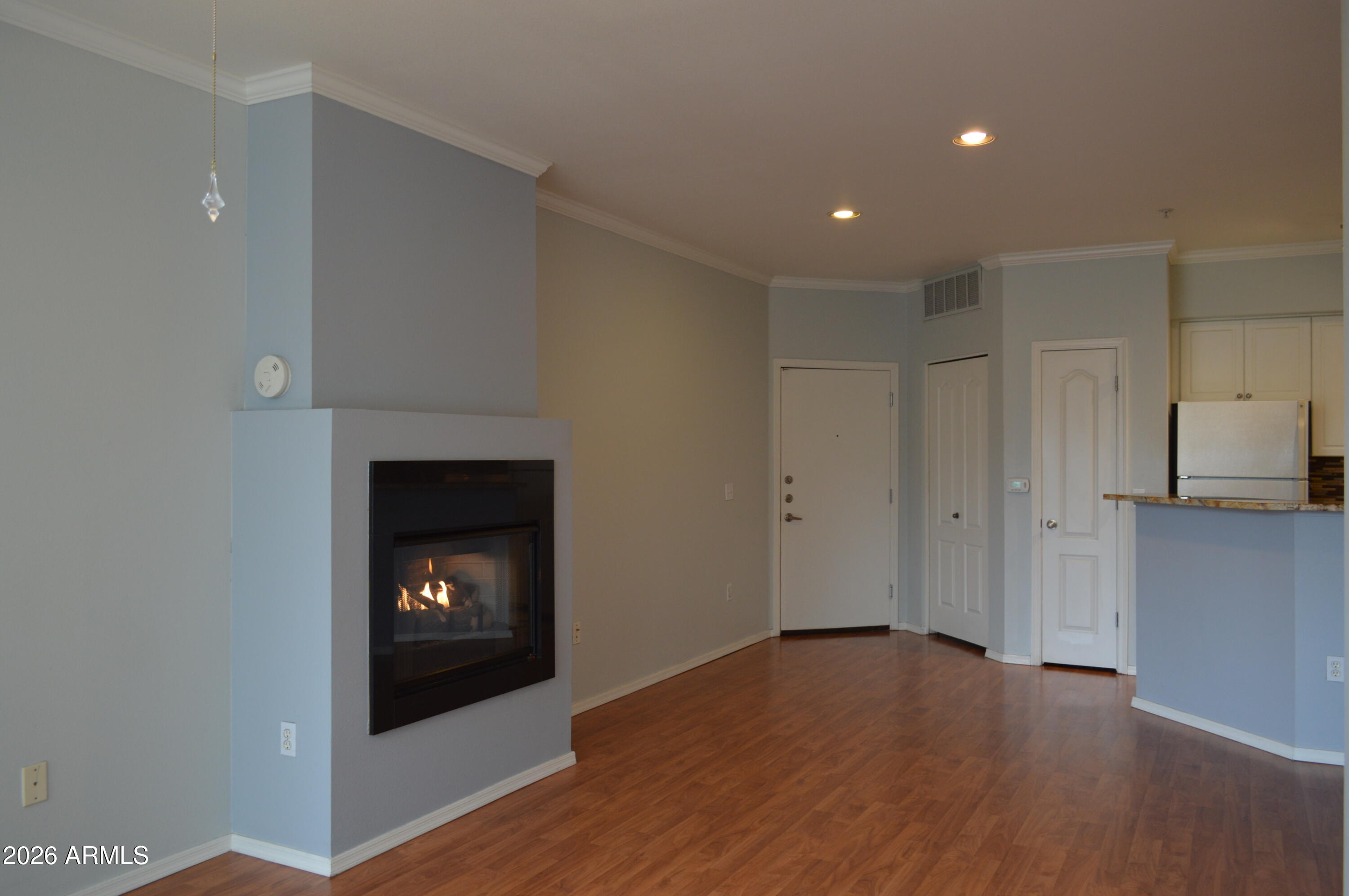 1701 East Colter Street, Unit 308 Phoenix, AZ 85016 - Photo 1 of 67 a view of an empty room and a fireplace