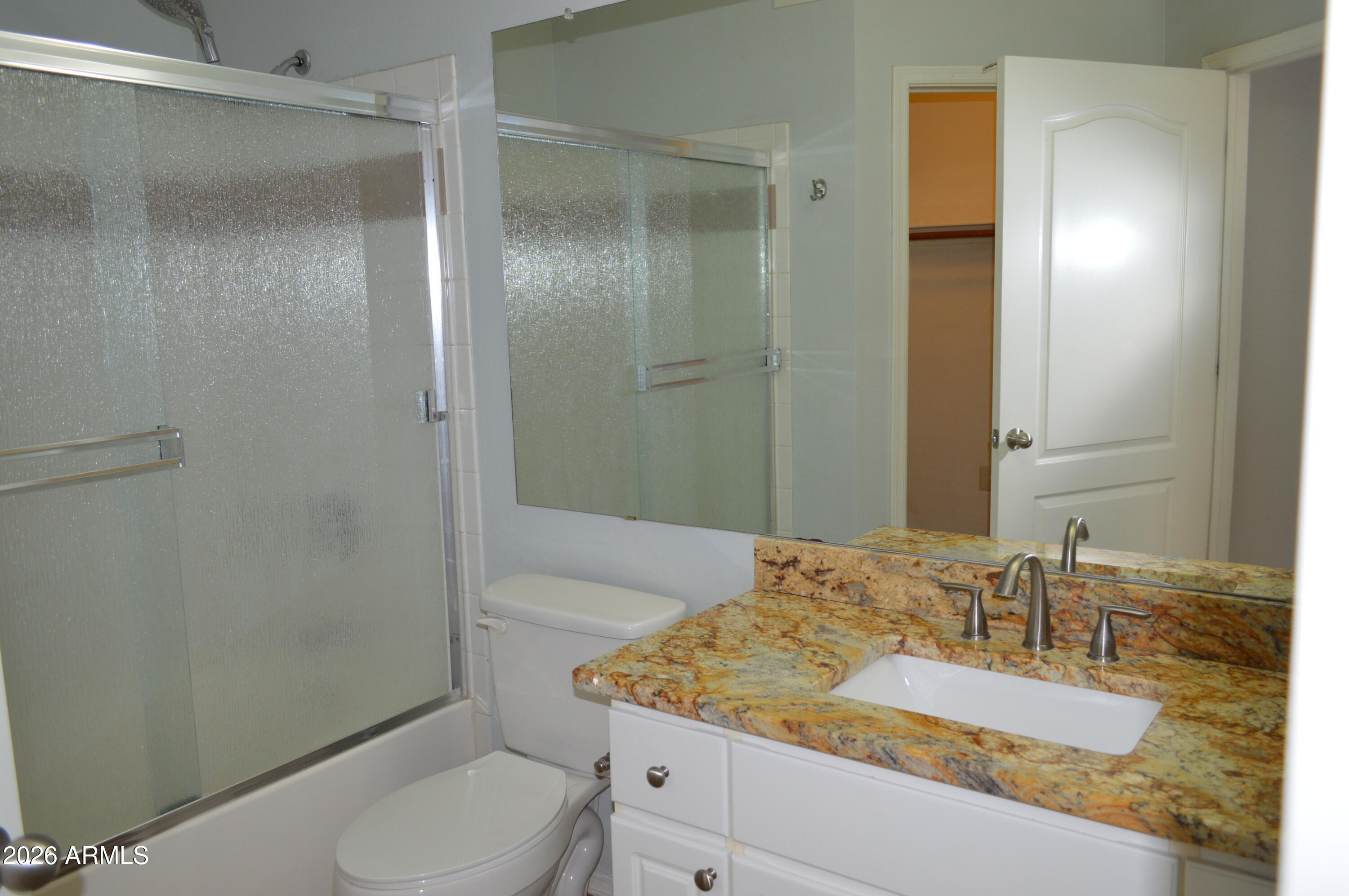 1701 East Colter Street, Unit 308 Phoenix, AZ 85016 - Photo 21 of 67 a bathroom with a granite countertop sink toilet and shower