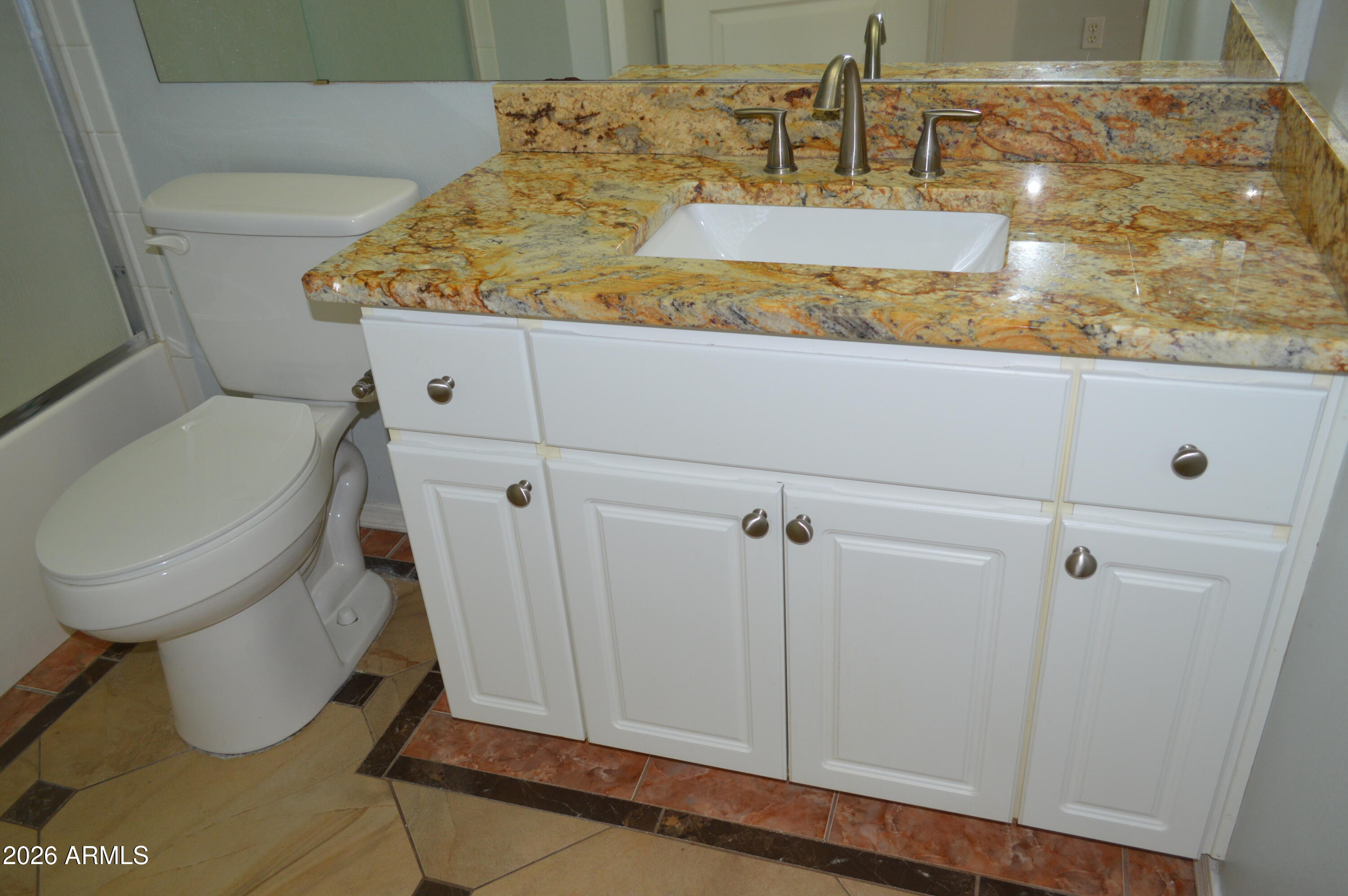 1701 East Colter Street, Unit 308 Phoenix, AZ 85016 - Photo 22 of 67 a bathroom with a granite countertop sink and a toilet