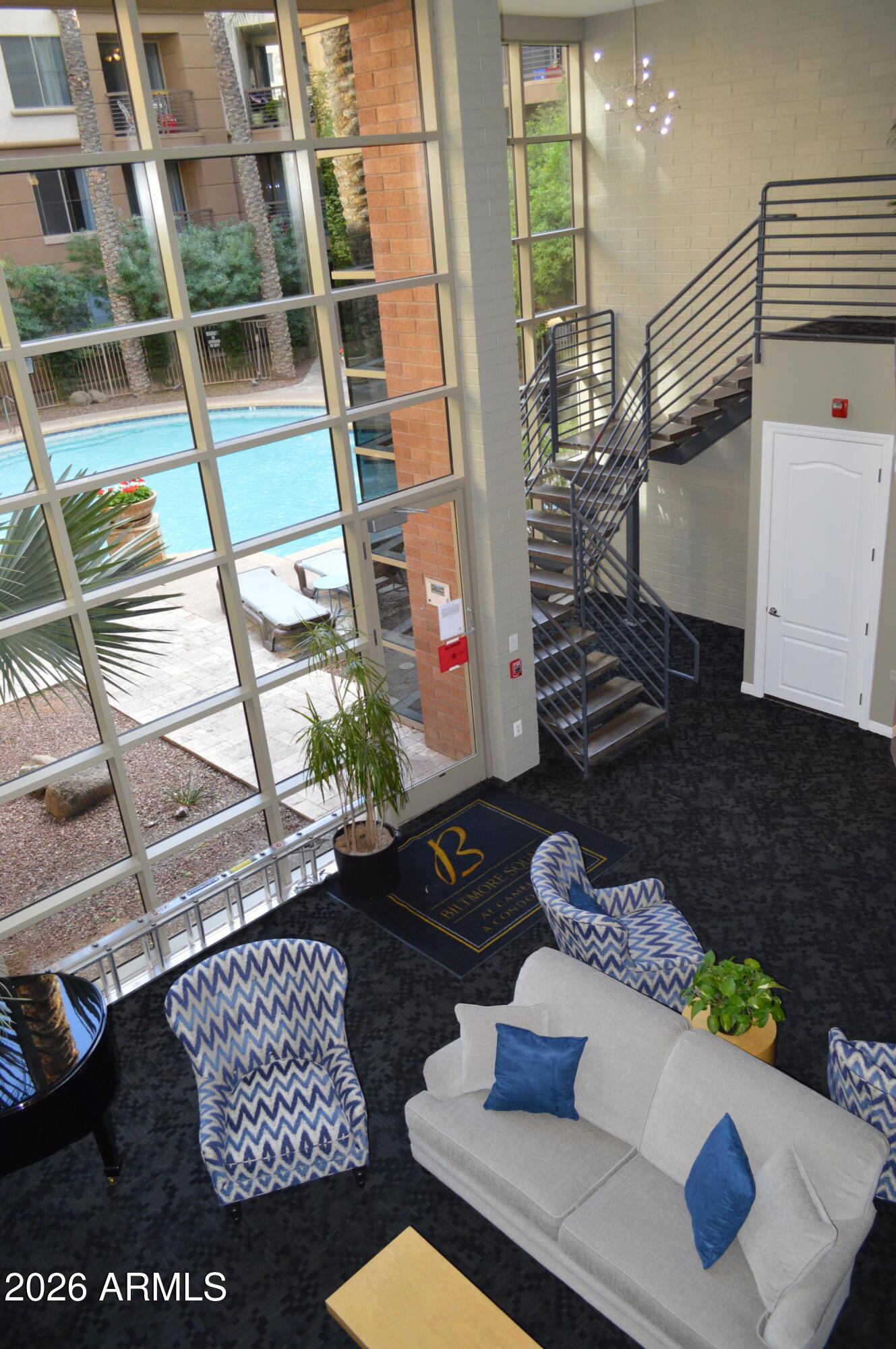 1701 East Colter Street, Unit 308 Phoenix, AZ 85016 - Photo 37 of 67 a living room with furniture and a potted plant