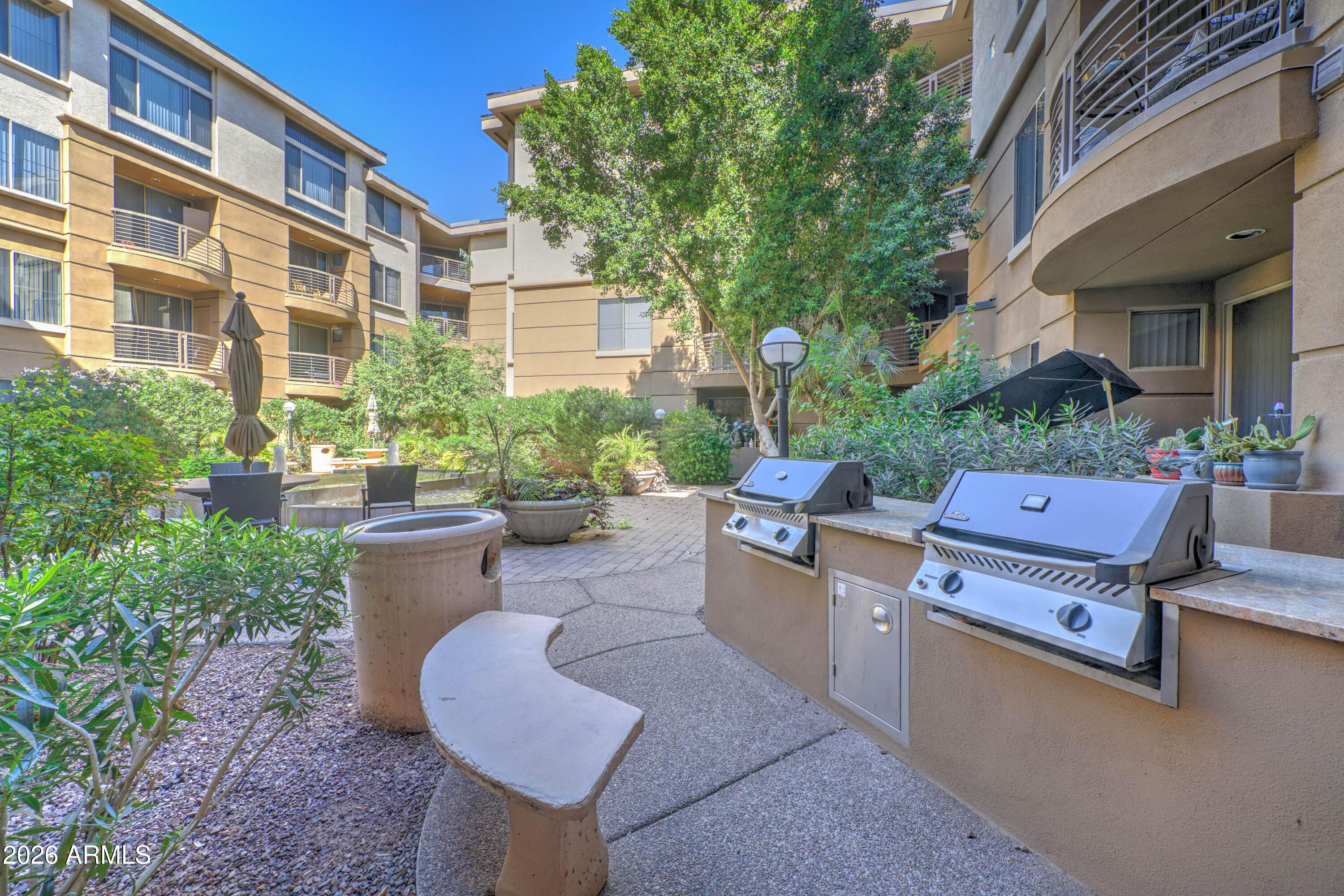 1701 East Colter Street, Unit 308 Phoenix, AZ 85016 - Photo 48 of 67 a backyard of a house with outdoor seating