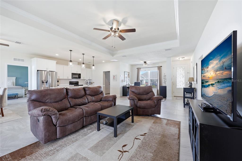 2168 Southwest 245th Terrace Newberry, FL 32669 - Photo 11 of 34 a living room with furniture and a flat screen tv