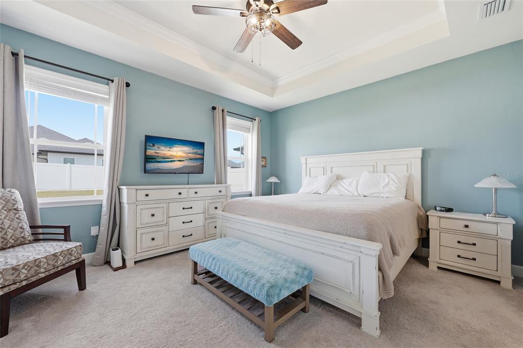 2168 Southwest 245th Terrace Newberry, FL 32669 - Photo 13 of 34 a bedroom with a bed and a flat screen tv