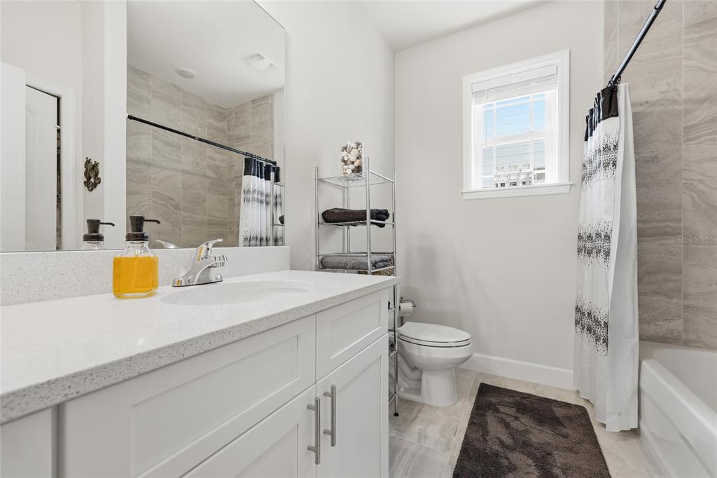 2168 Southwest 245th Terrace Newberry, FL 32669 - Photo 19 of 34 a bathroom with a sink a toilet and shower