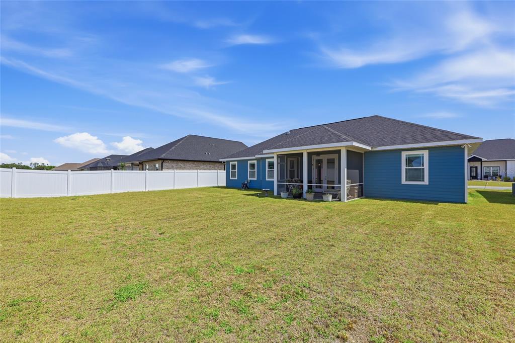 2168 Southwest 245th Terrace Newberry, FL 32669 - Photo 24 of 34 a front view of a house with a yard