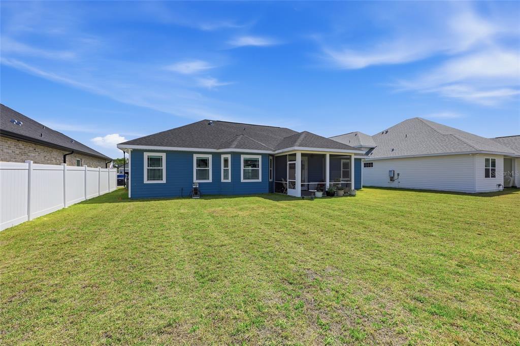 2168 Southwest 245th Terrace Newberry, FL 32669 - Photo 25 of 34 a view of a house with a garden and yard