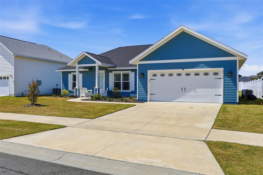 2168 Southwest 245th Terrace Newberry, FL 32669 - Photo 27 of 34 a front view of a house with swimming pool