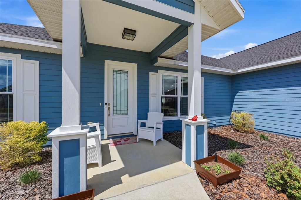 2168 Southwest 245th Terrace Newberry, FL 32669 - Photo 28 of 34 a front view of a house with outdoor seating