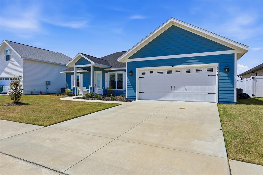 2168 Southwest 245th Terrace Newberry, FL 32669 - Photo 30 of 34 a front view of a house with a yard