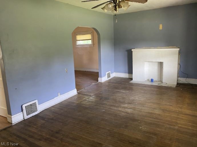 2304 Lake Rd Boulevard Northwest Canton, OH 44708 - Photo 5 of 5 Unfurnished living room featuring dark hardwood / wood-style flooring and ceiling fan