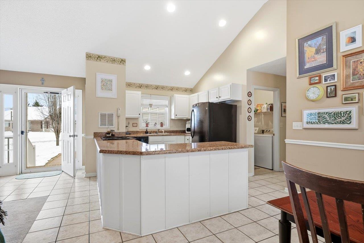 41 Long Bow Road Waynesboro, VA 22980 - Photo 13 of 45 a kitchen with stainless steel appliances kitchen island granite countertop a table and chairs