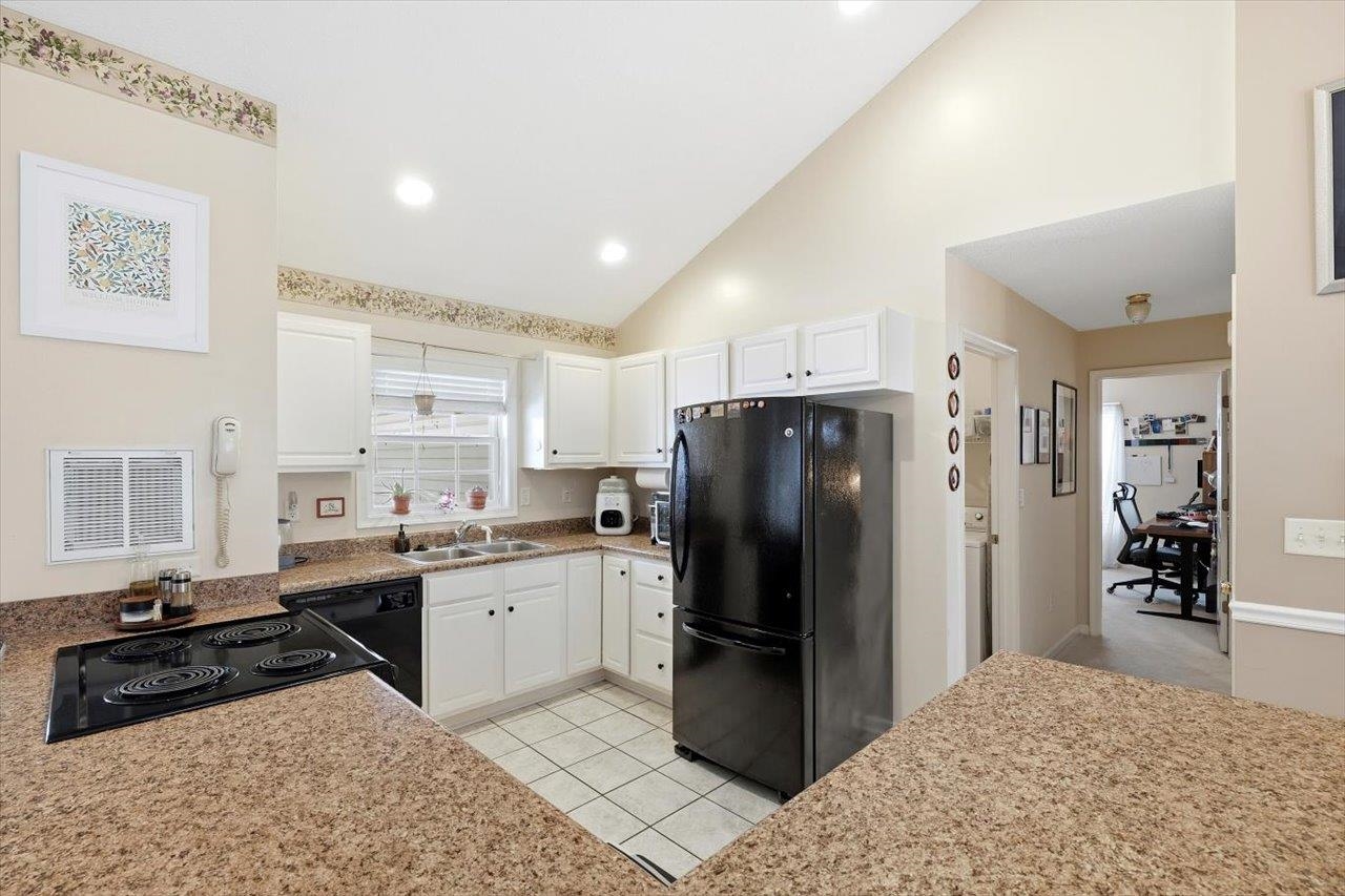 41 Long Bow Road Waynesboro, VA 22980 - Photo 14 of 45 a kitchen with a refrigerator a stove a sink and a dining table